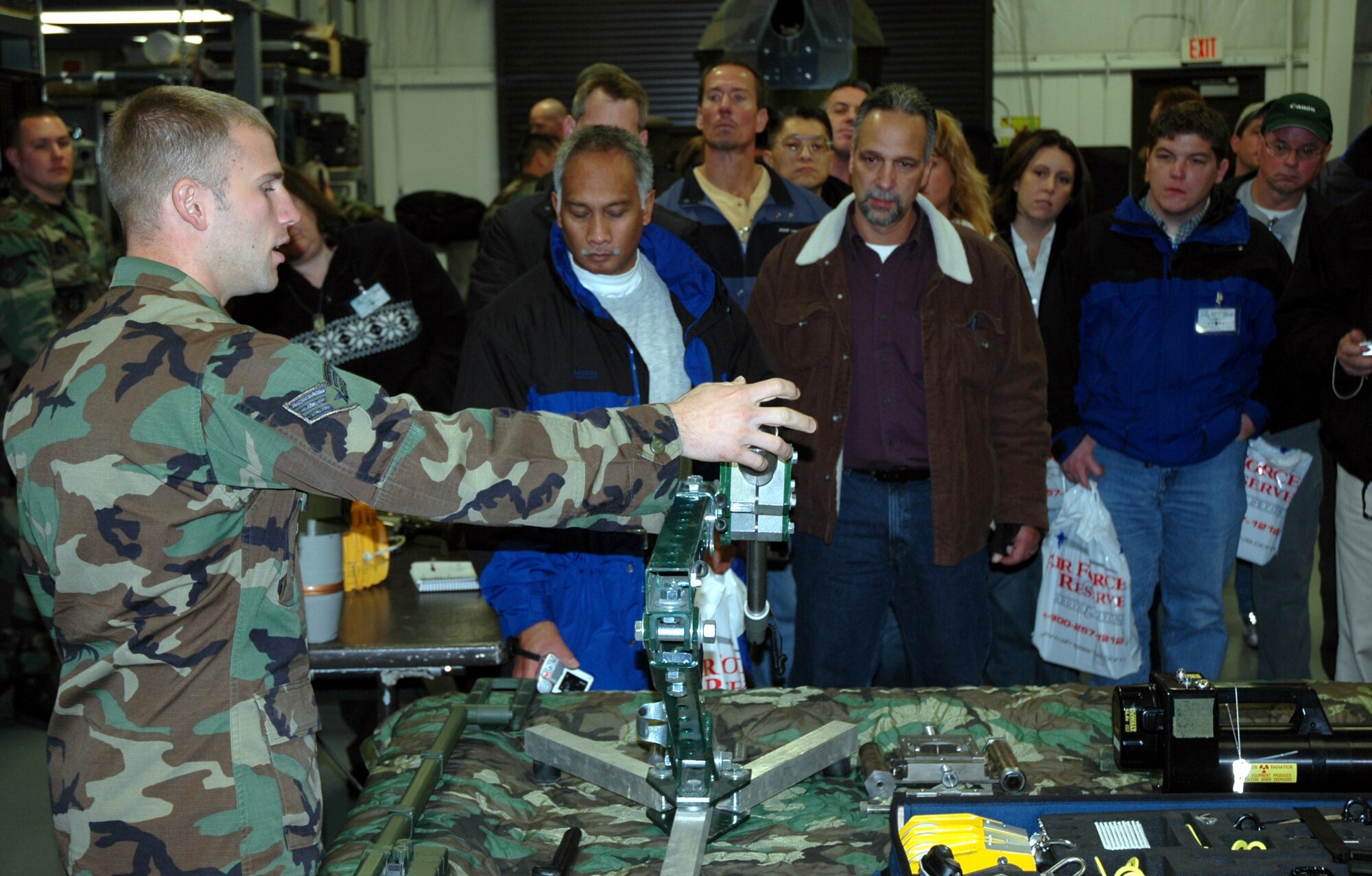 Senior Airman Shaun Lundgren, 446th Civil Engineer Squadron Explosive Ordnance Flight, explains to civilian employers of Reservists how certain small robots can help detect and disable explosives.  The tour was part of the 446th Airlift Wing's Employer Orientation Day where employers of Air Force Reservists spend a day learning what their employees do when performing the Reserve mission.  