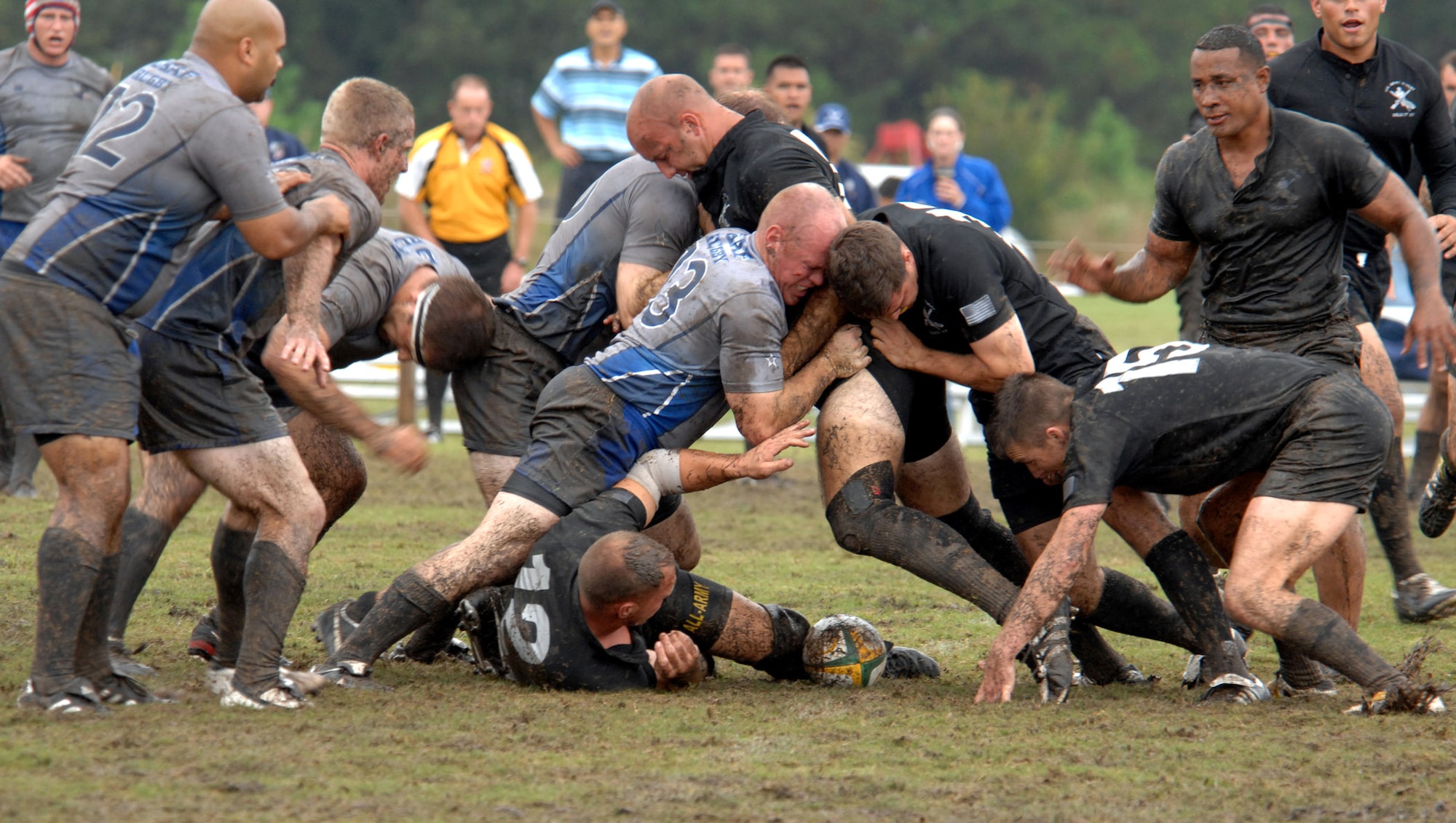 Two Army rugby players attempt to ruck Air Force player James Hubby while attempting to retrieve the ball during the 2007 Armed Forces Rugby Tournament Oct. 27 at Marine Corps Base Camp Lejeune, N.C.  A ruck occurs when two players bind onto each other to attempt to push the opposition away from the ball. (U.S. Air Force photo/Airman 1st Class Greg C. Biondo)