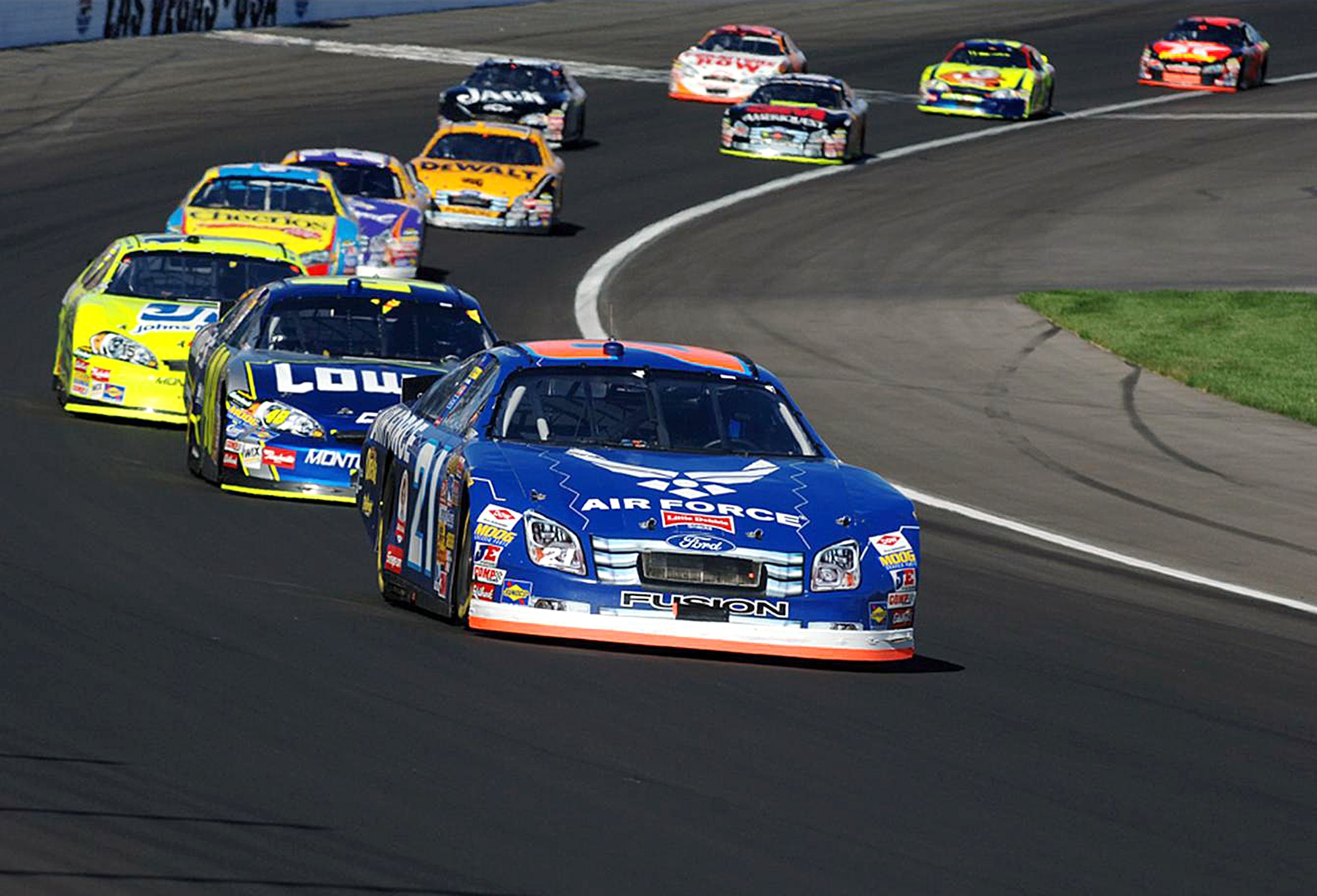 No. 21 Air Force Ford Fusion leads a lap in front of Jimmy Johnson in one of the 2007 Nextel Cup Series NASCAR races this past season.  Next year's racing season falls under the banner of the Sprint Cup Series. (Photo/Master Sgt. Scott F. Reed)