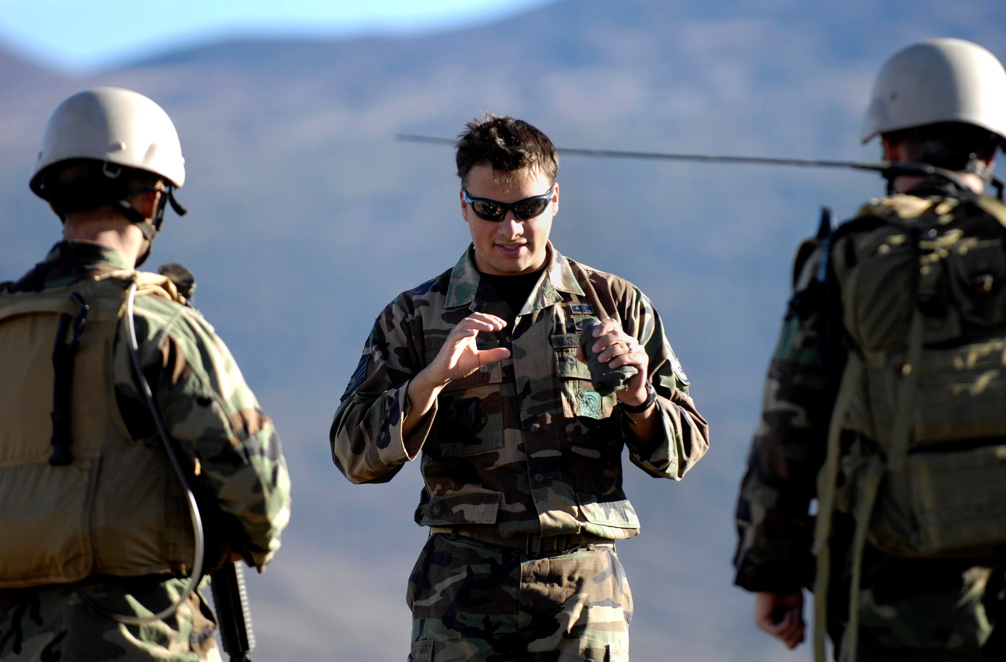 Staff Sgt. George Earhart reviews advanced self-aid buddy care and medical evacuation training with Airmen Oct. 23 at the Pohakuloa Training Area on the big island of Hawaii. The Airmen are tactical air control party members from the 25th Air Support Operations Squadron, Wheeler Army Airfield, Hawaii. The TACPs are training as part of the Koa Lighting exercise where bombers fly from Guam and practice their targeting. (U.S. Air Force photo/Tech. Sgt. Shane A. Cuomo)