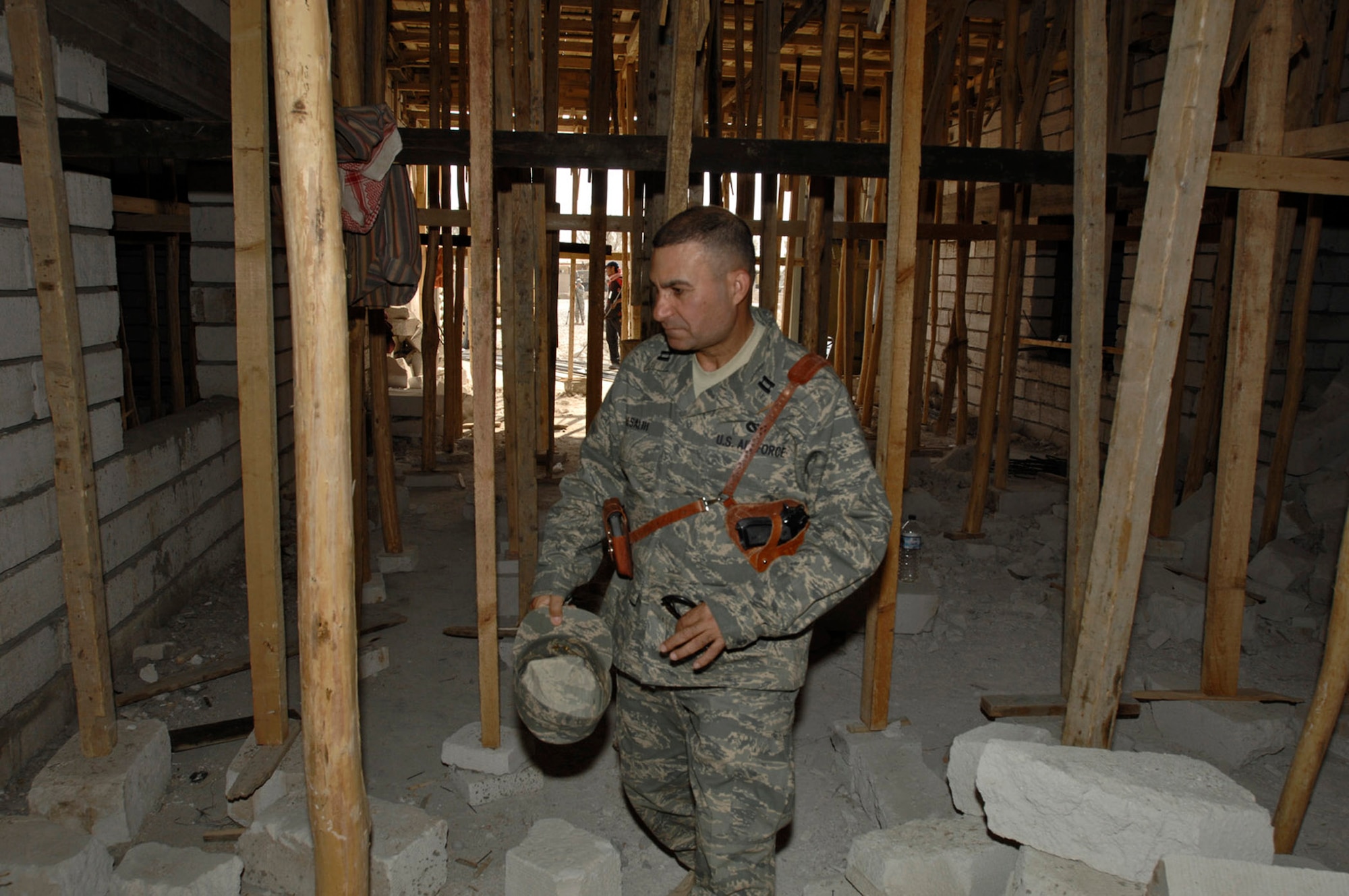 Capt. Rasul Alsalih, a project officer for the 732nd Expeditionary Civil Engineer Squadron, oversees construction projects by Iraqi nationals in an in-lieu-of tasking for the Army?s 20th Engineer Brigade. The captain was born in Iraq and fought against Saddam Hussein before being granted asylum in the U.S. and joining the Air Force. (U.S. Air Force photo/Airman 1st Class Jonathan Snyder)