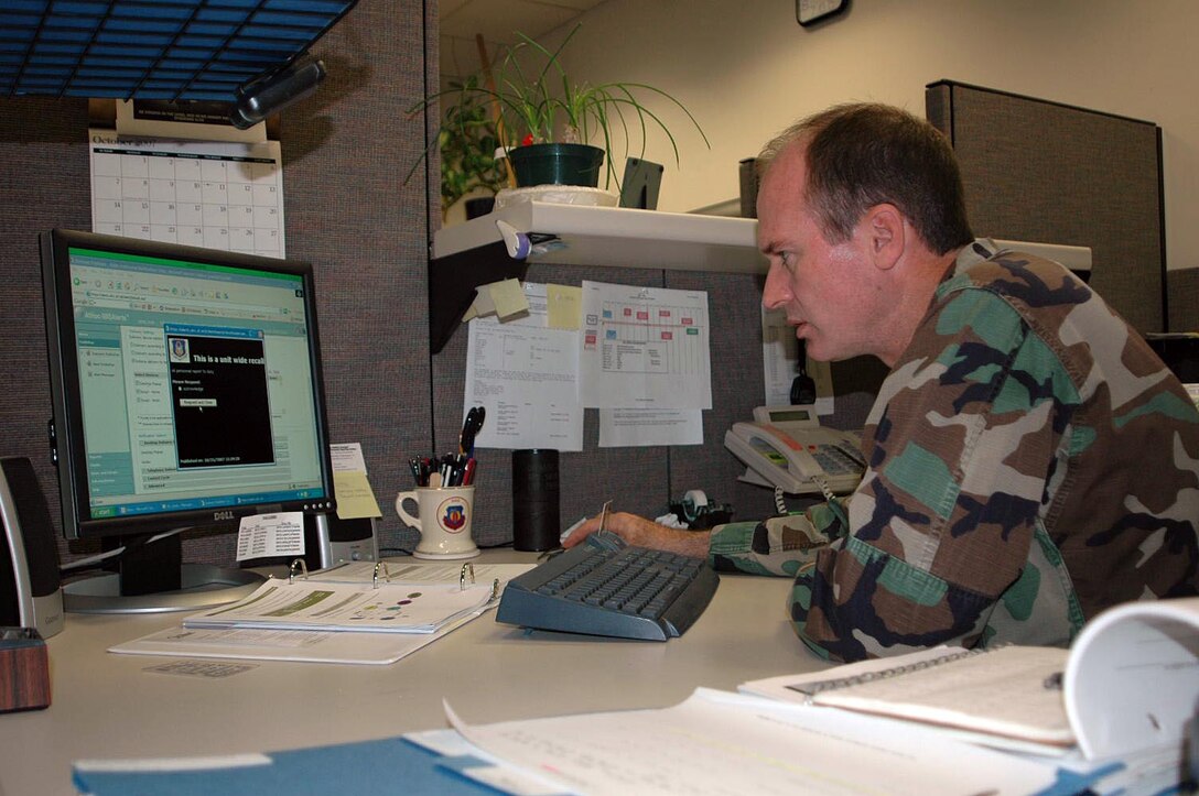 Lt. Col. Clint Burpo reviews one of the many pop-up messages available for editing and use on the IWS Alerts website. The IWS Alerts system is capable of recalling 2000 Reservists to active duty in a two-minute time frame. (Air Force Photo / Staff Sgt. K.L. Kimbrell)