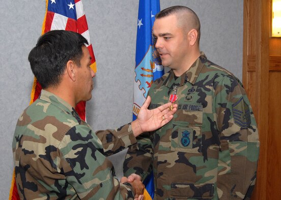 Master Sgt. Paul Tranetzke, 341st Missile Security Forces Squadron operations superintendent, is presented the Bronze Star Medal by Col. Steve Asher, 341st Security Forces Group commander, Oct. 25 at Malmstrom Air Force Base, Mont. Sergeant Tranetzke was awarded the Bronze Star for his exceptionally meritorious service while engaged in ground combat operations against the enemy supporting Operation Iraqi Freedom.(U.S. Air Force photo/John Turner) 