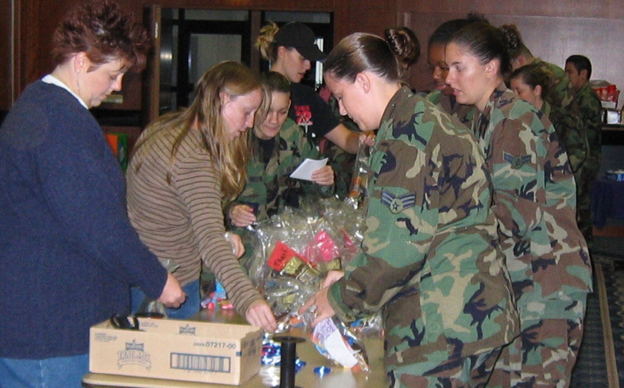 Sabers fill snack bags that will be distributed by members of Operation Open Arms to Airmen deploying from or through Spangdahlem Air Base in support of Operation Enduring Freedom or Operation Iraqi Freedom Oct. 24. (Courtesy photo)