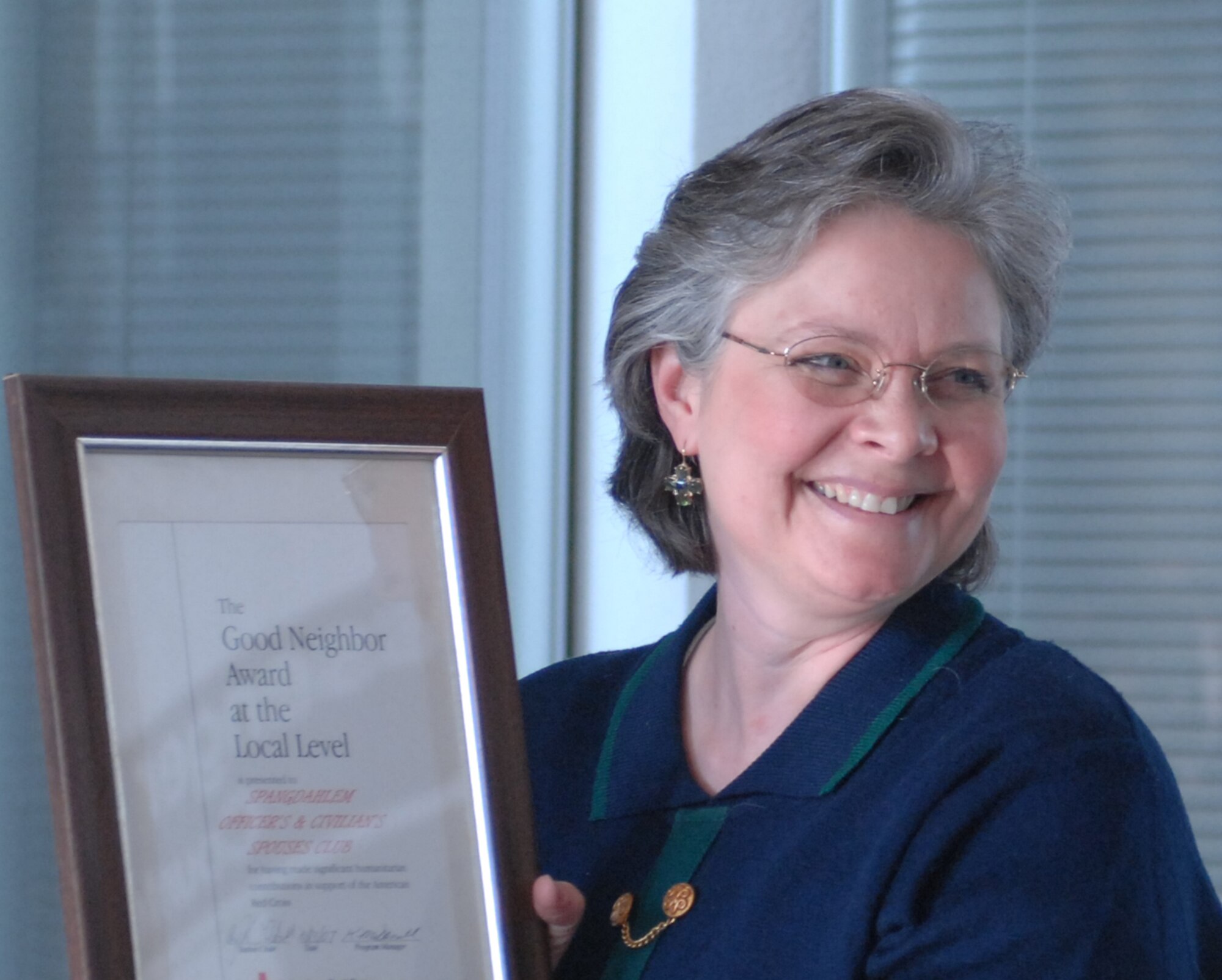 Diane Wido, spouse of Chaplain (Lt. Col.) Robert Wido, was recognized by the American Red Cross for her assistance with Operation Open Arms during a ceremony Oct. 23. (U.S. Air Force photo/Airman 1st Class Jennifer Calhoun)