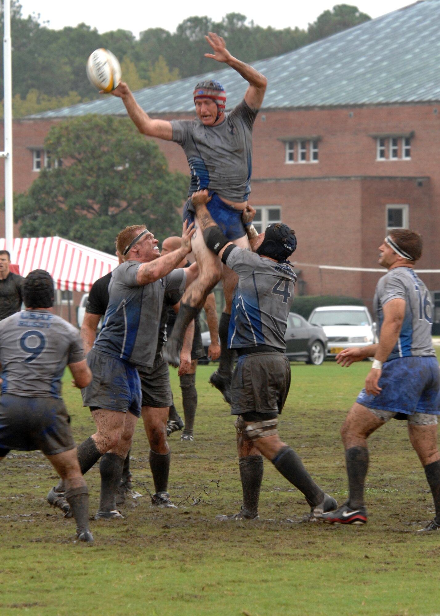 MARINE CORPS BASE CAMP LEJEUNE, N.C. - Tech. Sergeant James D. Reed Jr. attempts to tip the ball to a teammate during a line-out in the championship game of the 2007 Armed Force Rugby Tournament October 27. A line-out is used to determine possesion after a ball has gone out of bounds. (U.S. Air Force photo by Airman 1st Class Greg C. Biondo)
