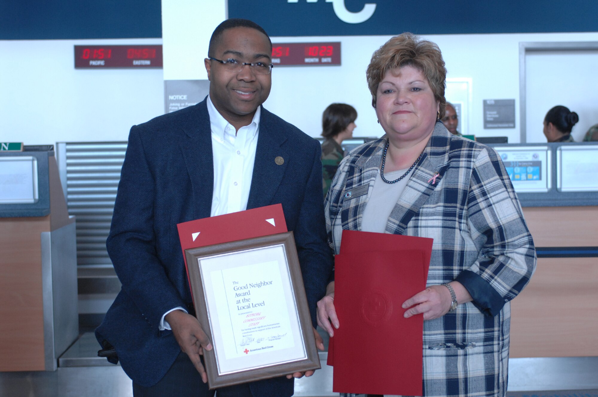 Jesse Anderson III and Ernestina Vasquez, both from the Bitburg commissary, were recognized by the American Red Cross for their assistance with Operation Open Arms during a ceremony Oct. 23. (U.S. Air Force photo/Airman 1st Class Jennifer Calhoun)