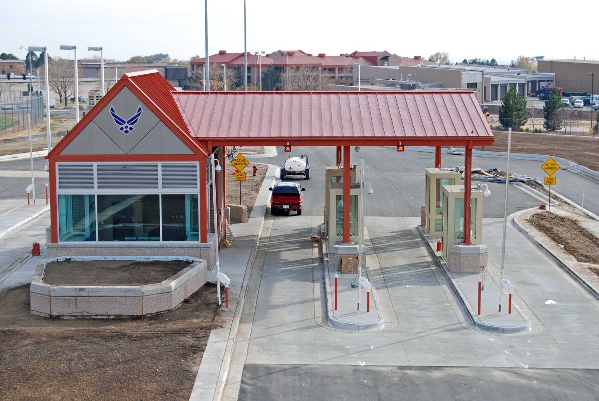 Following a year-long renovation and three-month closure, the West Gate re-opens to traffic at 5 a.m. Nov. 5. Renovations include a new Visitor's Center, added security features and extra lanes to handle more traffic. There is a grand opening ceremony at the gate at 9:30 a.m. Nov. 5.
New gate hours following the opening are: West Gate open 24 hours daily (Visitors Center open 6 a.m. to 5 p.m. Monday to Friday); North Gate open 6 a.m. to 6 p.m. Monday to Friday, closed Saturday and Sunday; East Gate open 5 a.m. to 10 p.m. Monday to Friday, 6 a.m. to 10 p.m. Saturday and Sunday. (U.S. Air Force photo by Steve Brady)