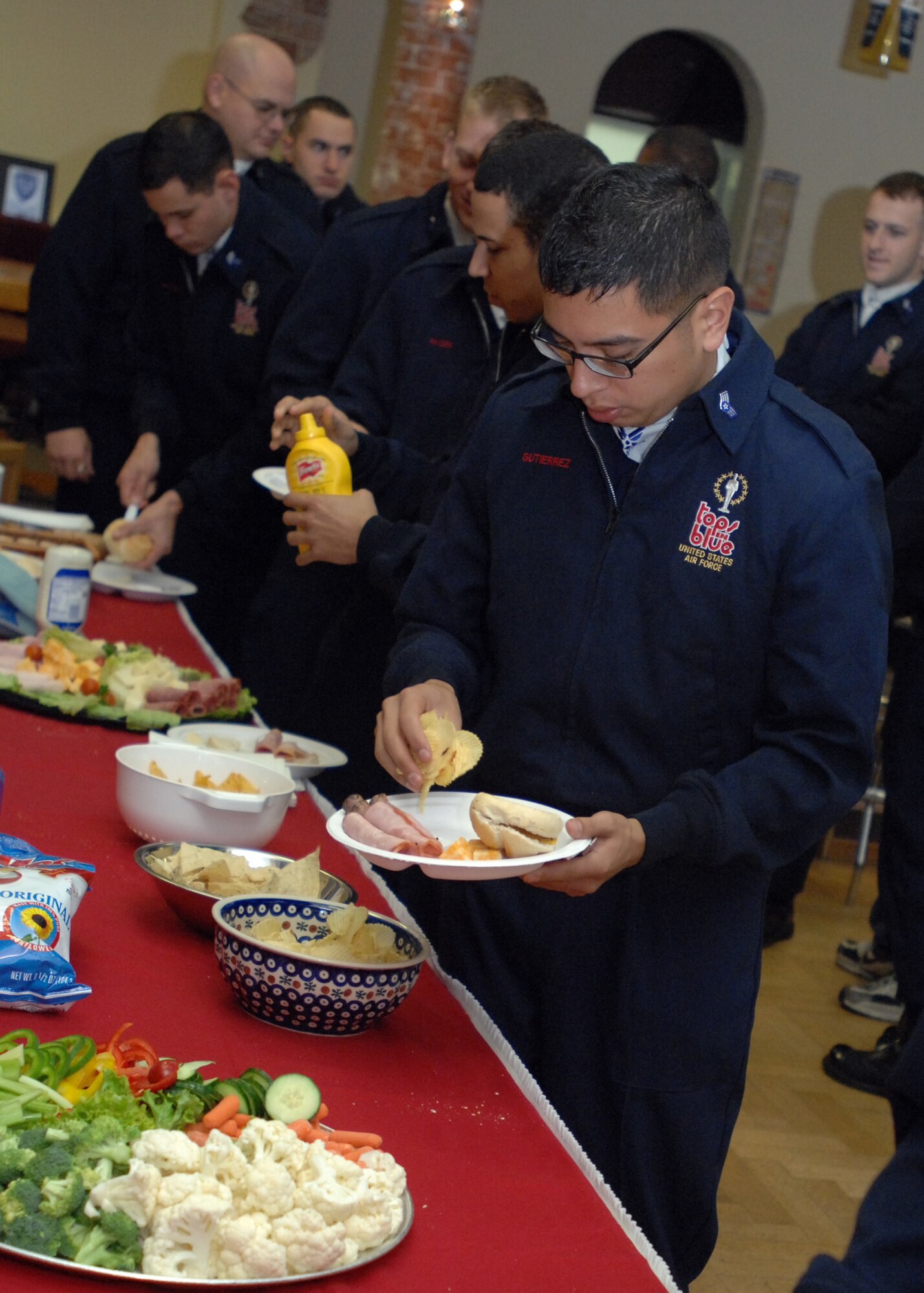 SPANGDAHLEM AIR BASE, Germany -- Air Force Tops In Blue, take a few minutes to enjoy lunch at the Brick House before setting up their stage for performance Oct. 29. (U.S. Air Force photo/Airman 1st Class Jenifer Calhoun)