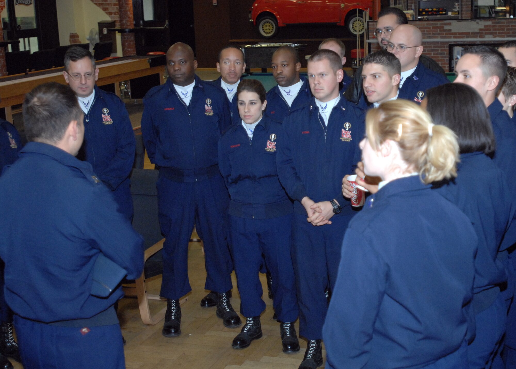 SPANGDAHLEM AIR BASE, Germany -- Capt. Alex Ruiz, from the Air Force performance group Tops In Blue, briefs fellow team members about what would be occurring during set up for their performance Oct. 30. (U.S. Air Force photo/Airman 1st Class Jenifer Calhoun) 