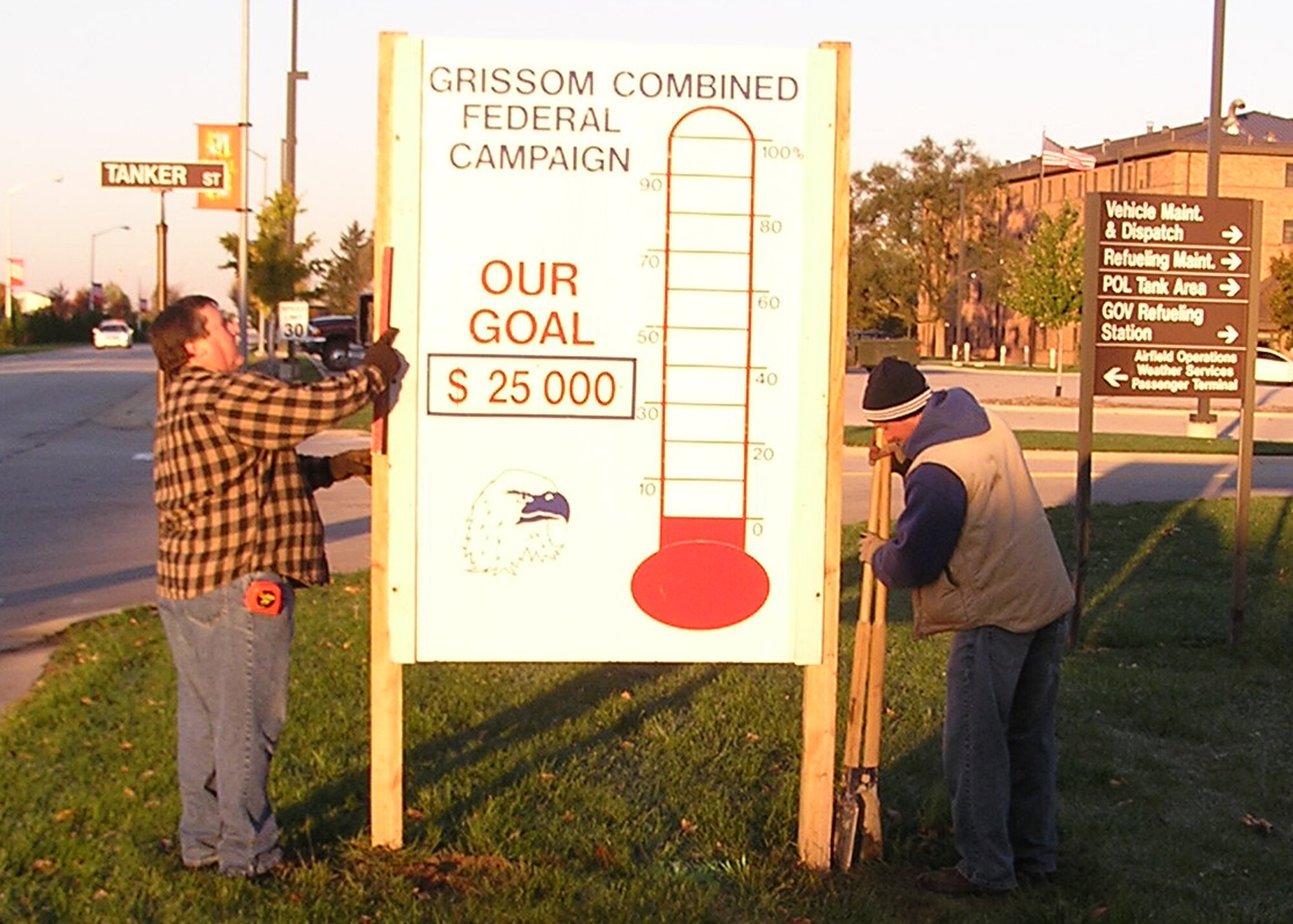 GRISSOM AIR RESERVE BASE, Ind. -- Grissom employees Dana Watson and Danny Kindlesparker install Grissoms Combined Federal Campaign thermometer. The CFC is the military's annual fundraiser for more than 2,000 organizations. For more information on the CFC visit www.cfcindiana.org. (Photo by Mr. Jeff Woodring)