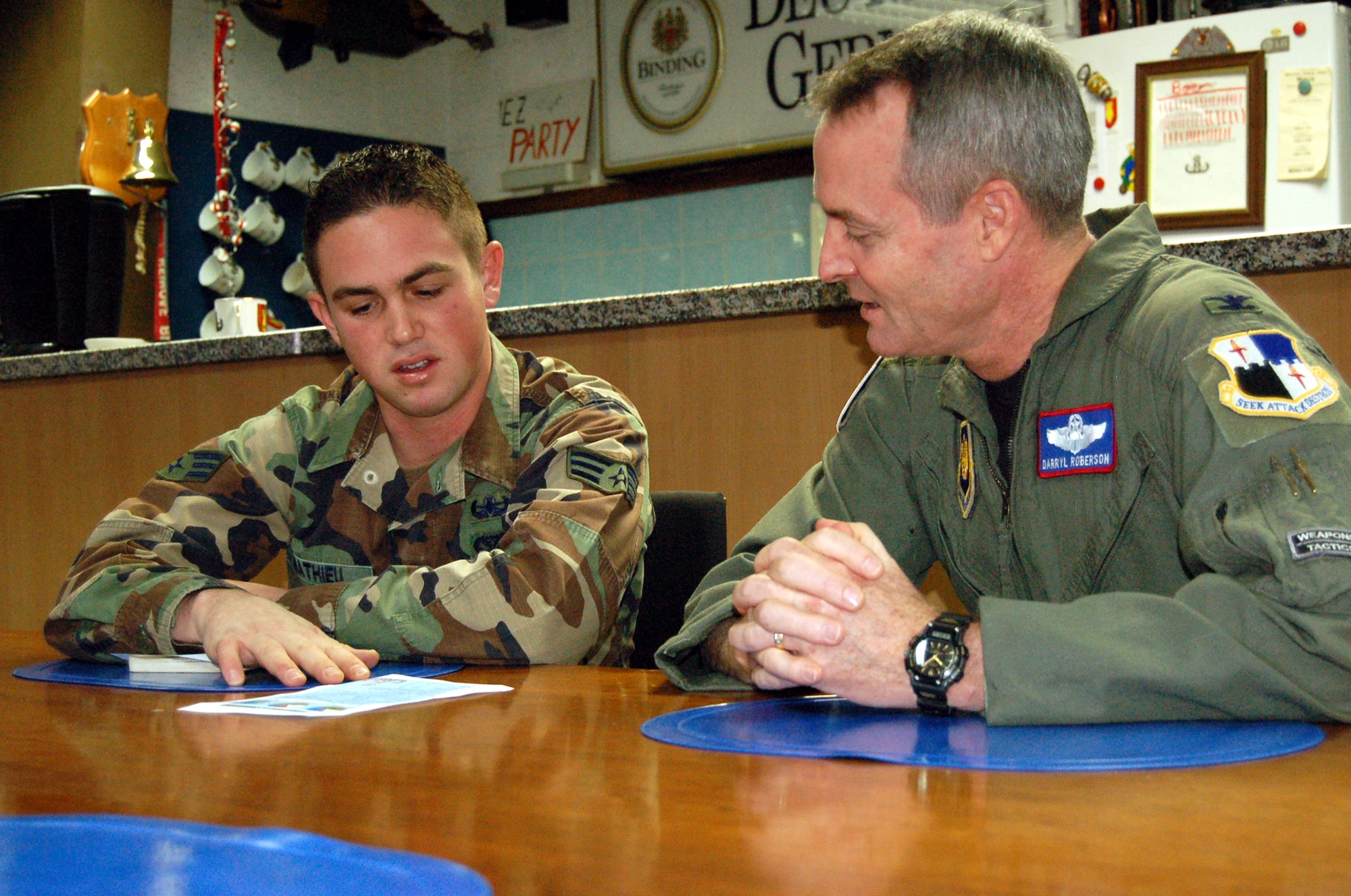 SPANGDAHLEM AIR BASE – Senior Airman Jesse Mathieu, 52nd Civil Engineer Squadron explosive ordnance disposal journeyman, explains the EOD deployment cycle to Col. Darryl Roberson, 52nd Fighter Wing commander, as he is shadowed by the commander Oct. 30. Airman Mathieu is a native of Citrus Heights, Calif. During his deployment in support of Operation Iraqi Freedom, Airman Mathieu earned a U.S. Army Commendation Medal. (U.S. Air Force photo/Staff Sgt. Tammie Moore)