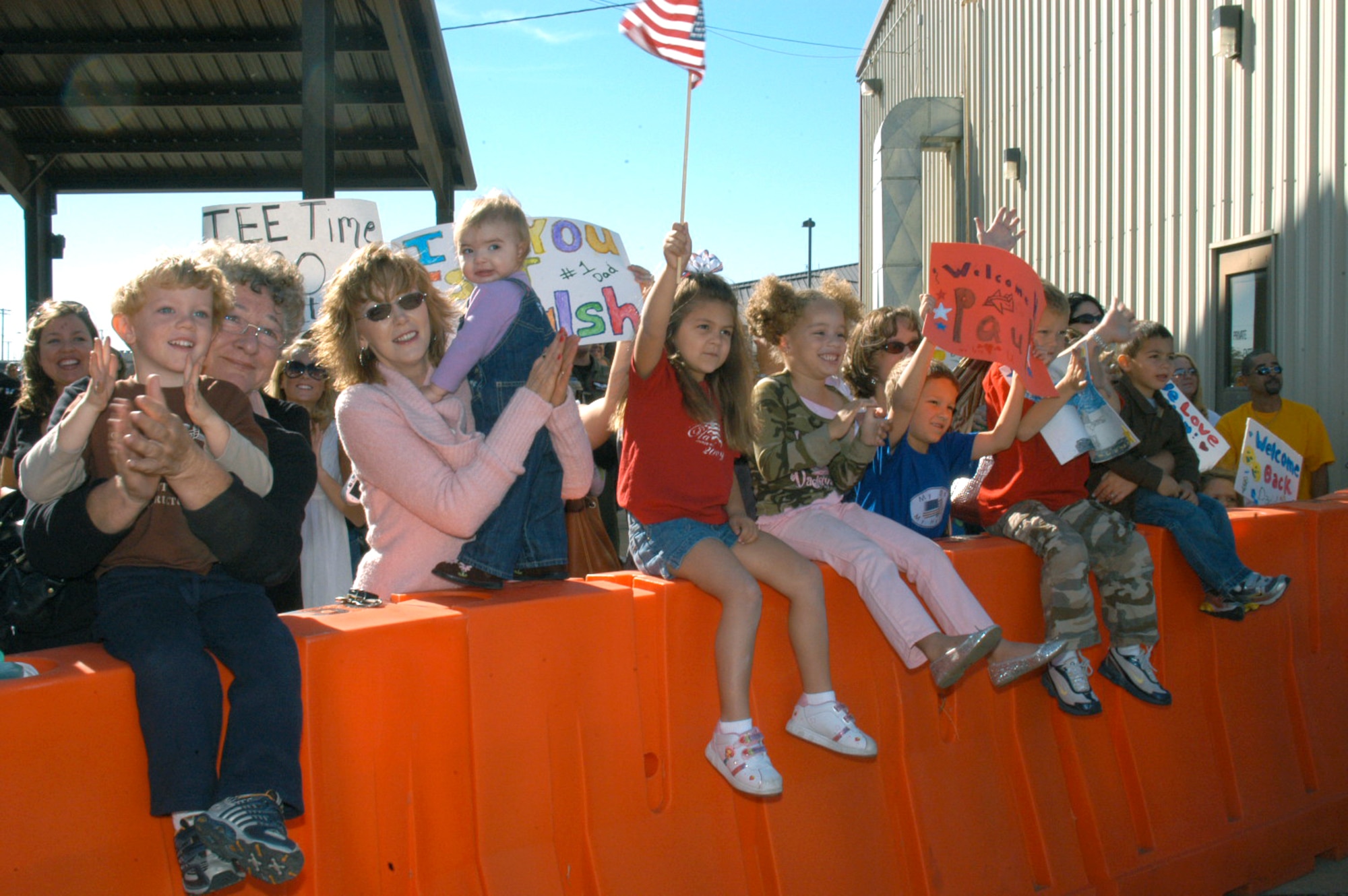 Families wait eagerly for the return of 39th Airlift Squadron and 317th Airlift Group personnel who arrived back at Dyess Oct. 20 from Southwest Asia. The 39th and 40th Airlift Squadrons are on a four-month alternating rotation from Dyess. Since 9/11, they have been fighting the Global War on Terror and providing humanitarian relief in Iraq, Afghanistan, and the Horn of Africa.  (U.S. Air Force photo by Senior Airman Carolyn Viss)