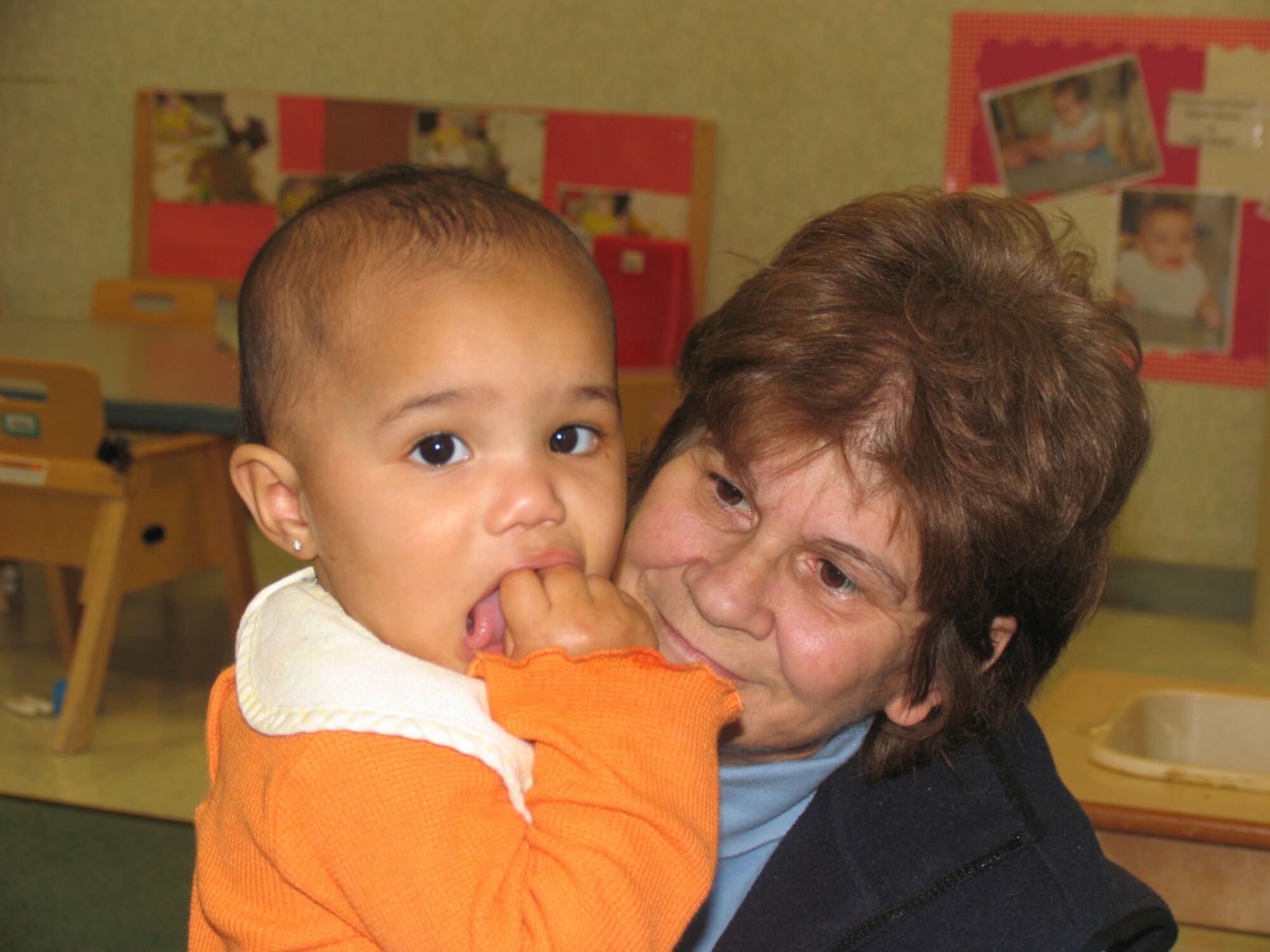 HANSCOM AFB, Mass. – Rita Millar, a caregiver at the Child Development Center spends time with 23-month-old Angela Brady on Oct. 29. The CDC is working toward gaining re-accreditation from the National Association for the Education of Young Children. Hanscom is one of the first Air Force bases to seek accreditation under the new NAEYC standards that were implemented in 2006. (U.S. Air Force photo by Rhonda Siciliano)

