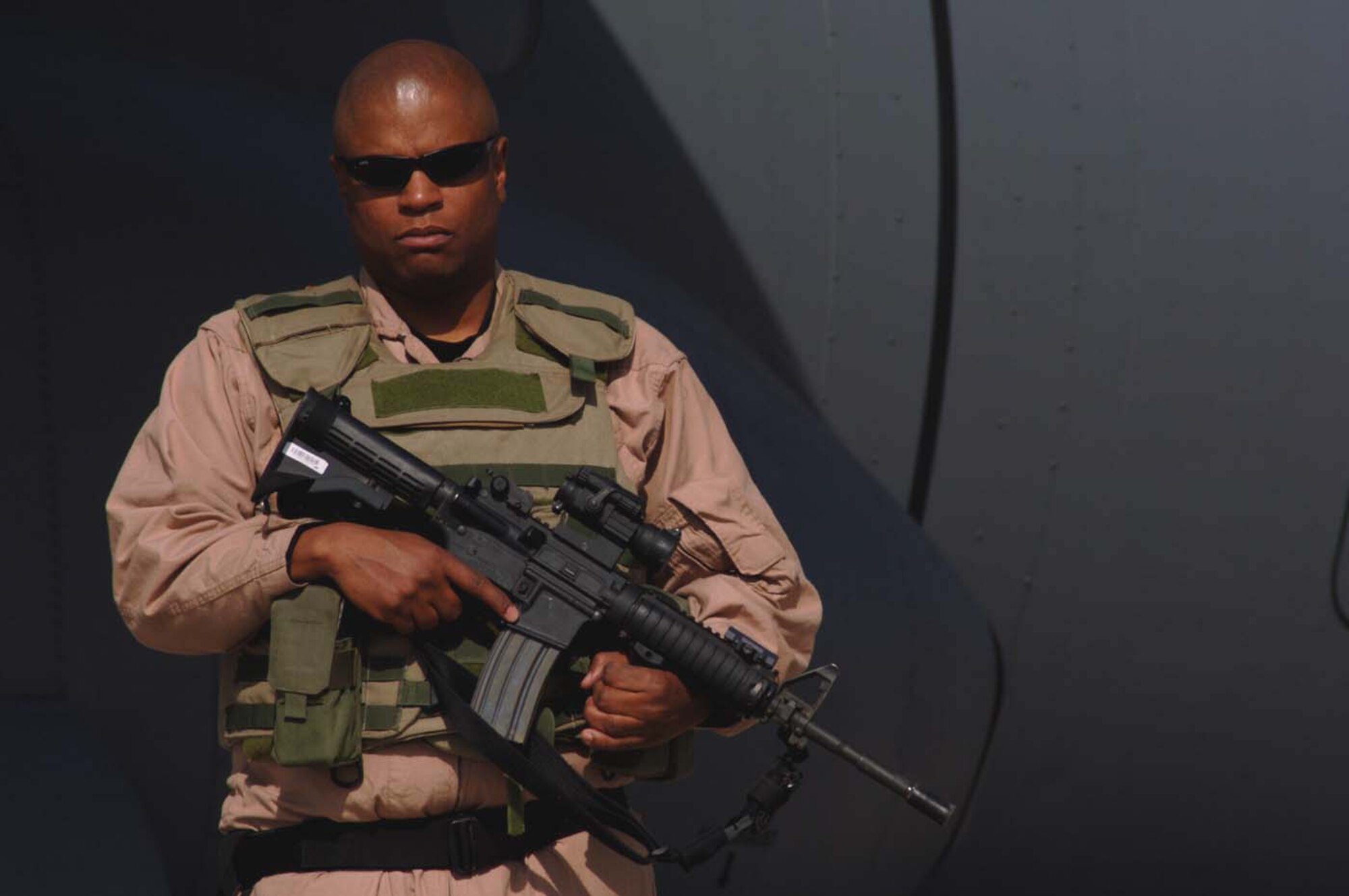 BAGRAM AIRFIELD, Afghanistan -- Master Sgt. Richard Coats, the 455 Expeditionary Security Forces Squadron operations superintendent, guards an aircraft at a forward operating base in Afghanistan. Sergeant Coats is a member of a Flyaway Security Team here. (U.S. Air Force photo/Staff Sgt. Mike Andriacco)