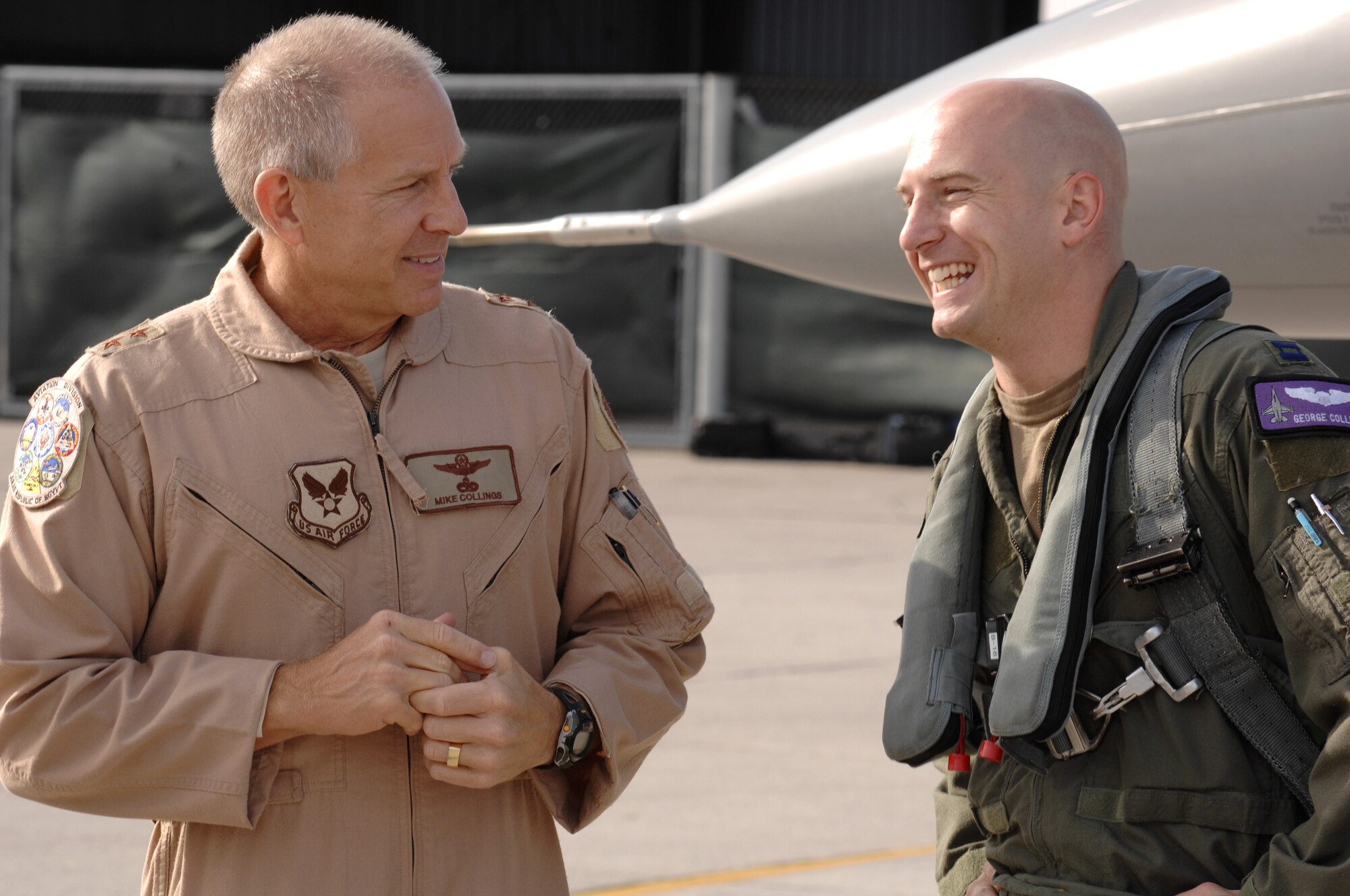 AVIANO AIR BASE, Italy--A suprised Capt. George Collings greets his father, Major Gen. Michael Collings, the Senior U.S. Defense Representative to Egypt, on the flightline Oct. 29.  General Collings flew into Aviano Air Base to present Capt. Collings with the medal for distinguishing himself by extraordinary achievement while participating in aerial flight as an F-16CG pilot with the 510th Expeditionary Fighter Squadron based out of Balad Air Base, Iraq. (U.S. Air Force photo/Senior Airman Patrick Dixon) 