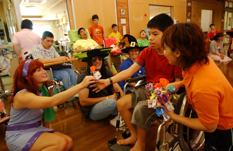 2 Lieutenant Amanda Reed, 18th Component Maintenance Squadron, accepts a gift made from the physically disabled children as a token of appreciation at the Okinawa Children Development Center in Okinawa, Japan, Oct. 27, 2007.
(U.S. Air Force photo/Tech. Sgt. Rey Ramon)

