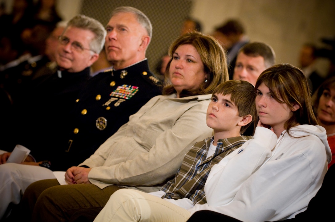 Rev. Daniel P. Coughlin, Chaplain, U.S House of Representatives, Gen. James T. Conway, Commandant of the Marine Corps, and the family of U.S Army Sgt. 1st Class Randall T. Lamberson, his wife Dana, son Evan and daughter Kelsi, listen during the Gold Medal of Remembrance ceremony, Washington, D.C., Oct. 29, 2007. 