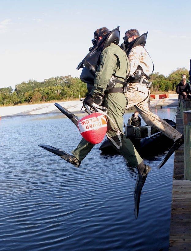 A swimmer gets ready to take-off as his teammate completes one of the 20 laps during the swimming relay event of the MIDAS Southside Challenge hosted by Marine Aerial Refueler Transport Squadron 252 Detachment A, Oct. 31. The challenge also included other events like a volleyball tournament, ping-pong tournament, 500 meter relay and boxing matches to end the day.