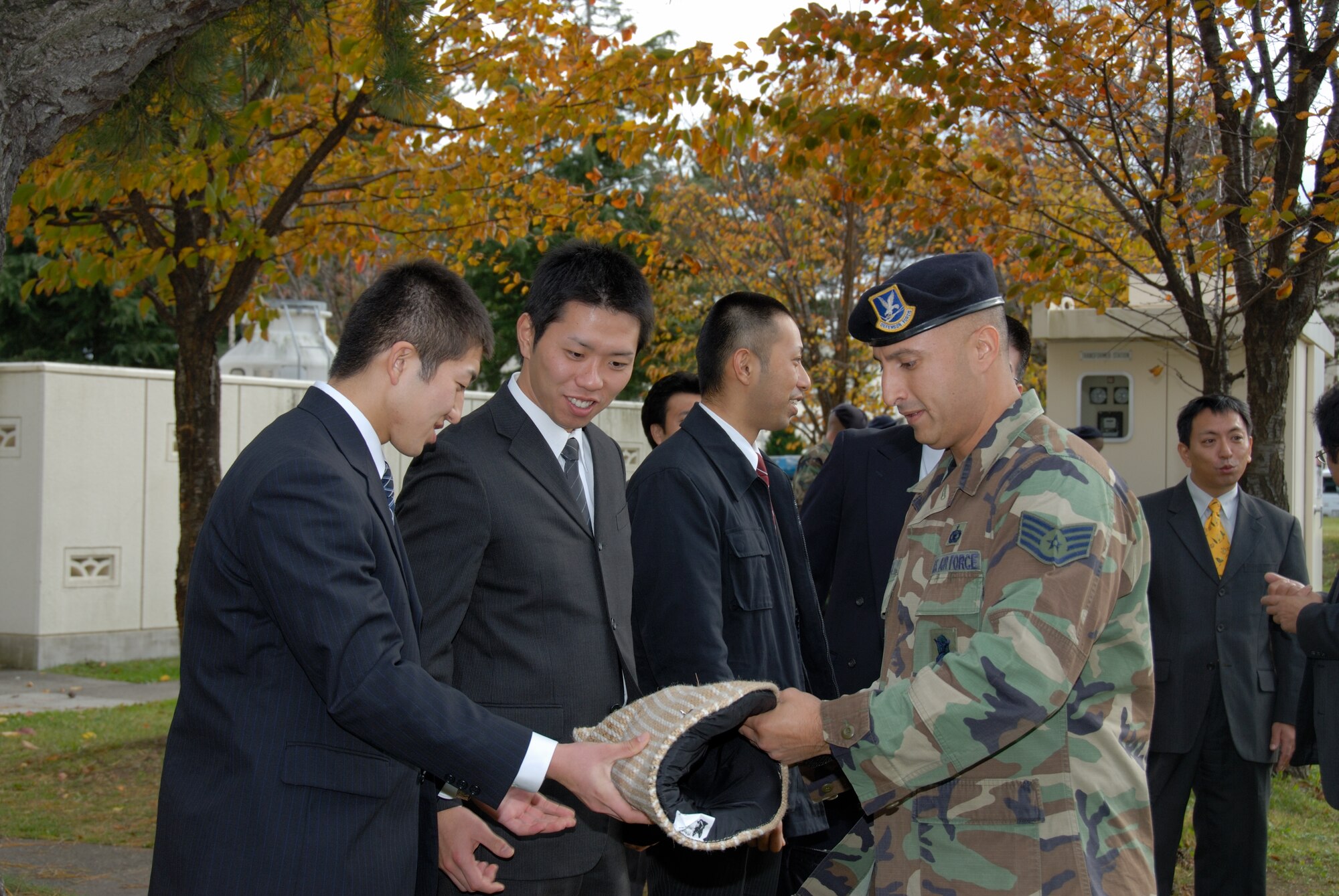MISAWA AIR BASE, Japan -- Staff Sgt. Manuel Garcia, a Military Working Dog handler with the 35th Security Forces Squadron, shows a bite wrap used for military working dogs training to members of the Aomori Police Academy during a tour of security forces operations on Oct. 30, 2007.  Security forces regularly hosts tours for Japanese government, military and law enforcement groups. (U.S. Air Force photo by Senior Airman Laura R. McFarlane)
