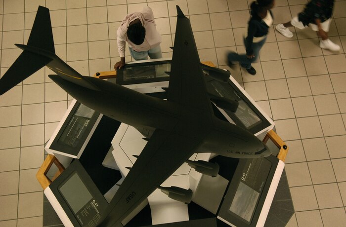 Visitors from the Air Force Combined Federal Campaign Shadow Program pass by the C-17 Globemaster display in the 15th Airlift Squadron during their tour of Charleston AFB Oct. 26. The program is an event sponsored by the Air Force CFC and is in its first year of touring the base. (U.S. Air Force photo/Senior Airman Clay Lancaster)