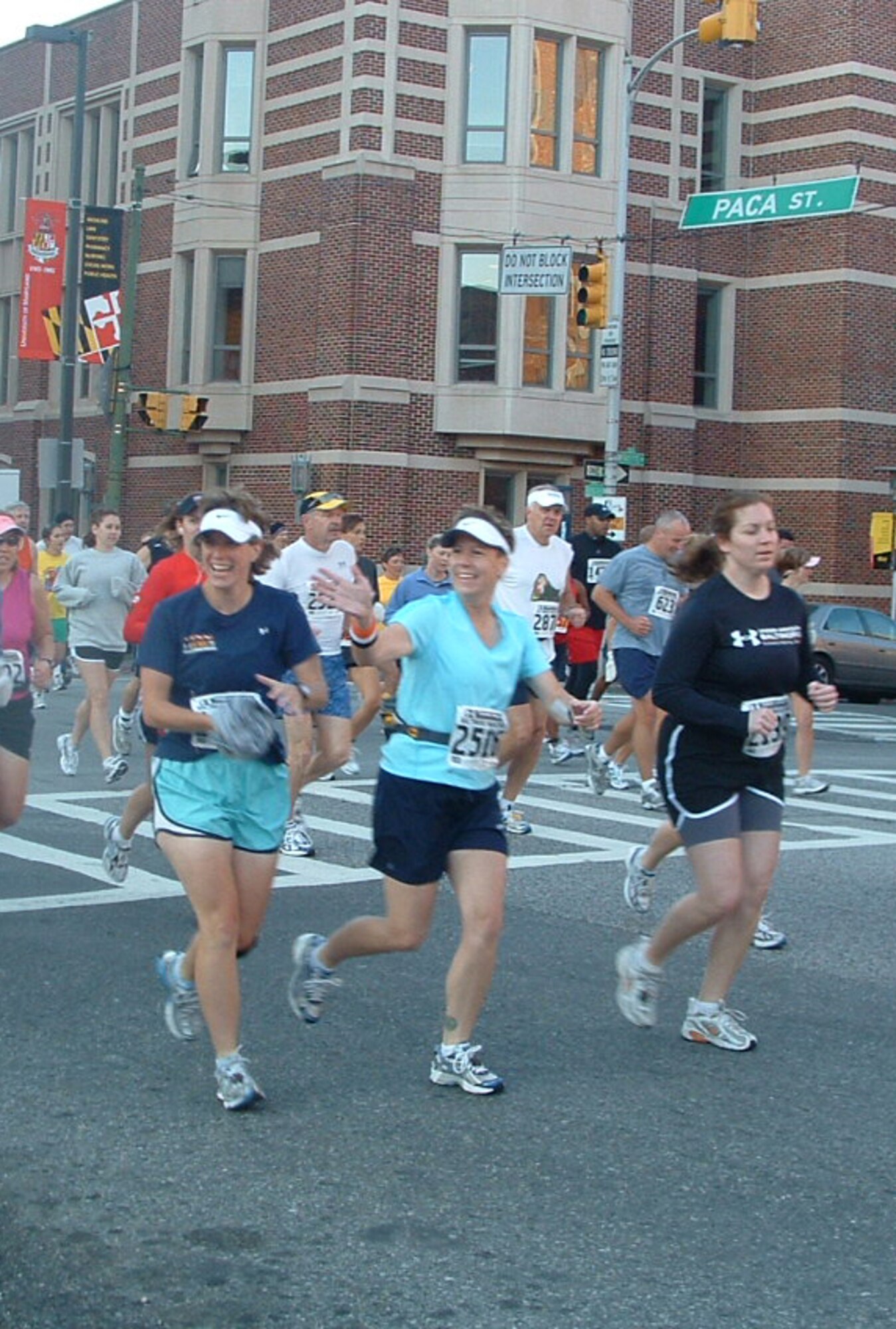 BALTIMORE -- Master Sgt. Shayne Sewell (front, center) waves to friends at the mile one marker Oct. 13. Her finishing time for the full distance of 26.2 miles was 5 hours and 17 minutes.  (U.S. Air Force photo/Colleen Barthel).