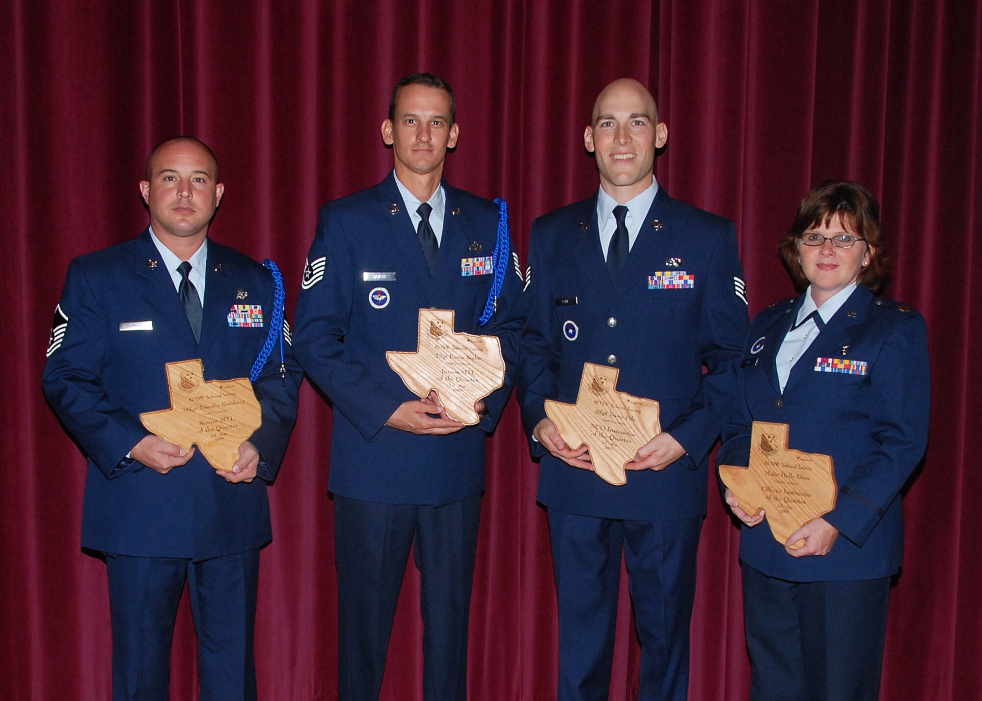 The winners for this quarter's 82nd Training Wing Technical Training Awards, held Oct. 30.  From left: Master Sgt. Timothy Bamburg, 82nd TRW, senior military training leader; Tech. Sgt. Kevin Taylor, 364th Training Squadron, junior MTL; Staff Sgt. Travis Pyle, 365th TRS, NCO instructor; and Maj. Holly Ginn, 383rd TRS, officer instructor.  Other winners were Master Sgt. Jonathan Abrams, 372nd TRS, flight chief; Master Sgt. Martin Symonds, 372nd TRS, SNCO instructor; Senior Airman Ralph Coleman, 372nd TRS, Airman instructor; and Mr. Keith Zehender, 372nd TRS, civilian instructor.  (U.S. Air Force photo/Mike Litteken)