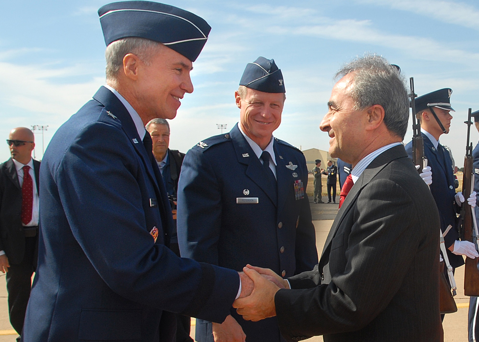 Brig. Gen. Richard Devereaux (left), 82nd Training Wing commander, and 80th Flying Training Wing Commander Col. Dave Petersen (center), offer well-wishes to Italian Minister of Defense Arturo Parisi Oct. 31 at Sheppard's flightline. The minister paid a quick visit to 50 Italian Air Force members at the Euro-NATO Joint Jet Pilot Training Program. (U.S. Air Force photo/Mike Litteken)