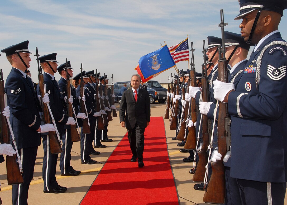 Italian Minister of Defense Arturo Parisi walks the red carpet to an awaiting aircraft Oct. 31 as he prepares to depart Sheppard following a visit with Italian Air Force members at the Euro-NATO Joint Jet Pilot Training Program. The country currently has 50 personnel participating in the international flying training program. (U.S. Air Force photo/Mike Litteken)