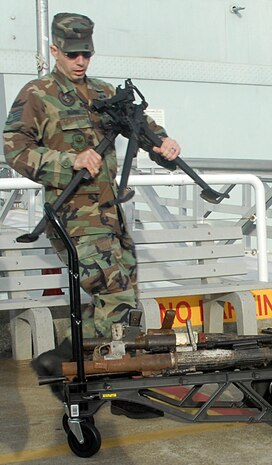 Staff Sgt. Nicholas Marino, 437th Civil Engineer Squadron, prepares to take the weapons that will be exhibited in the museum on to the USS Yorktown at the Patriots Point museum Oct. 19. (U.S. Air Force photo/Staff Sgt. Jennifer Arredondo)