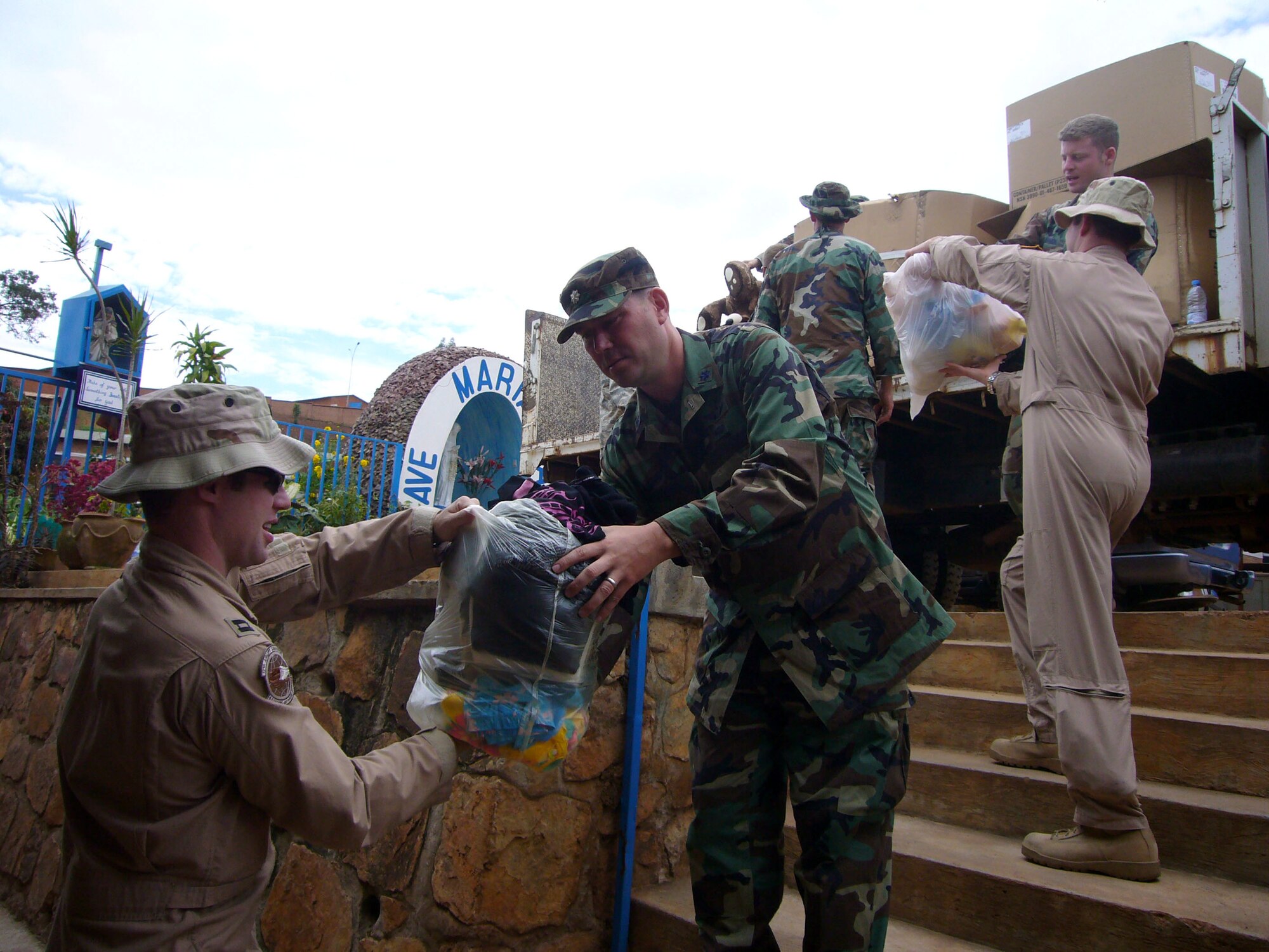 Airmen from the 786th Air Expeditionary Squadron deliver donations to an orphanage in Kigali, Rwanda, Oct. 27. The Airmen from Ramstein Air Base, Germany, and Charleston Air Force Base, S.C., are in Kigali to provide airlift support to the Rwanda Defense Force. (U.S. Air Force photo/Capt. Erin Dorrance)