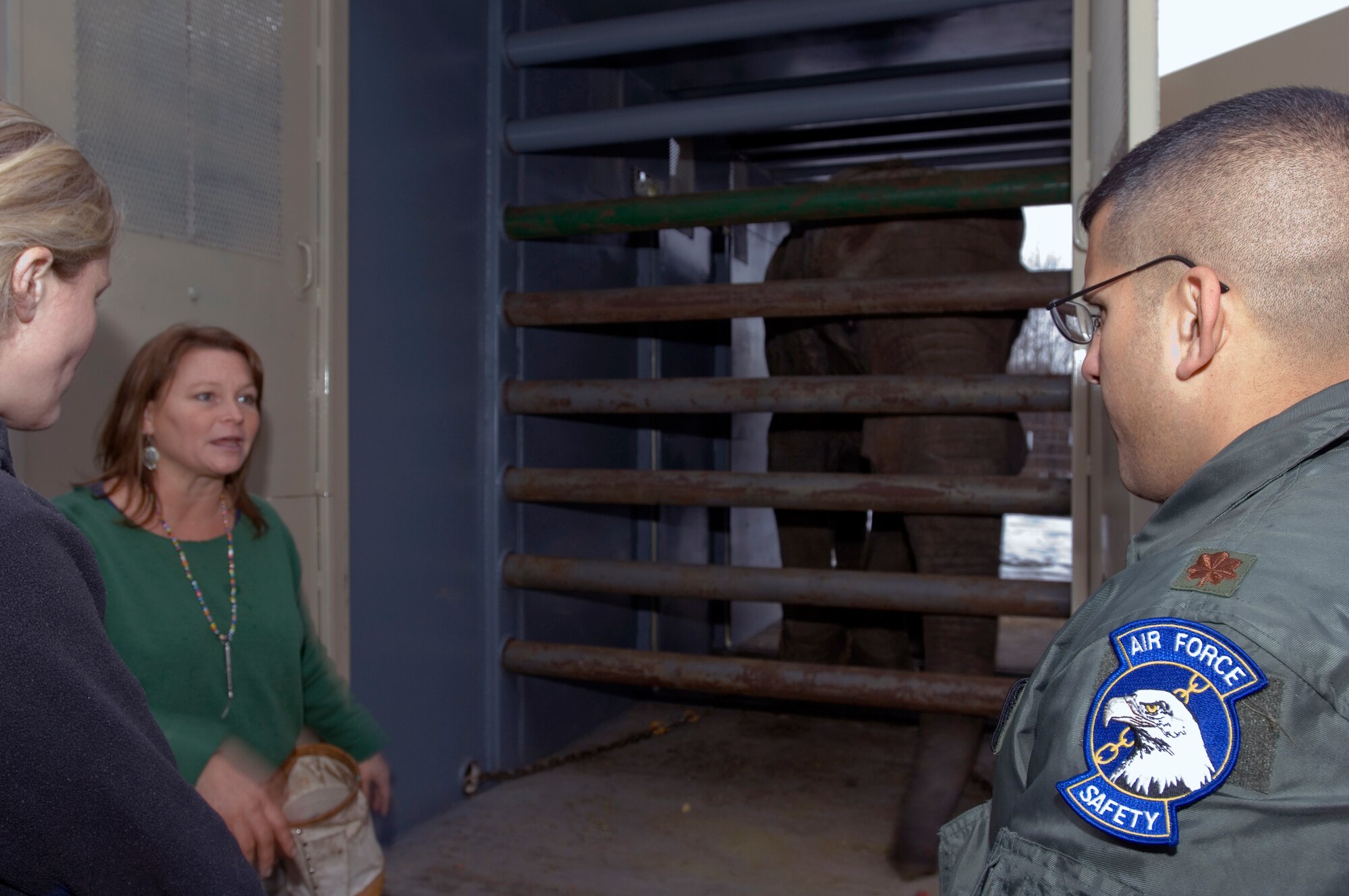 ANCHORAGE, Alaska -- Maj. Byron Miranda, an Air Force safety officer and C-17 Globemaster III pilot, listens to members of the Alasaka Zoo and the Performance Animal Welfare Society, or PAWS, as they answer questions about moving Alaska's only elephant, Maggie, to the PAWS sanctuary in California. A 517th Airlift Squadron C-17 Globemaster III from Elmendorf Air Force Base will transport the 8,000 pound African elephant Thursday. (U.S. Air Force photo by Tech. Sgt. Keith Brown)