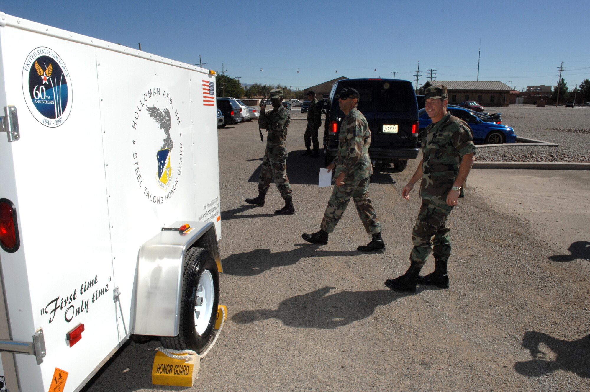 Brig. Gen. David Goldfein, 49th Fighter Wing commander, looks over the new Honor Guard trailer with Master Sgt. Paul Sanchez, Steel Talons Honor Guard NCOIC. The new trailer was bought with the $3,000 given to the Steel Talons by Lt. Gen. Norman Seip, 12th Air Force commander. The trailer is to haul around all the equipment the Honor Guard brings with them on details, (U.S. Air Force photo/Senior Airman Anthony Nelson)