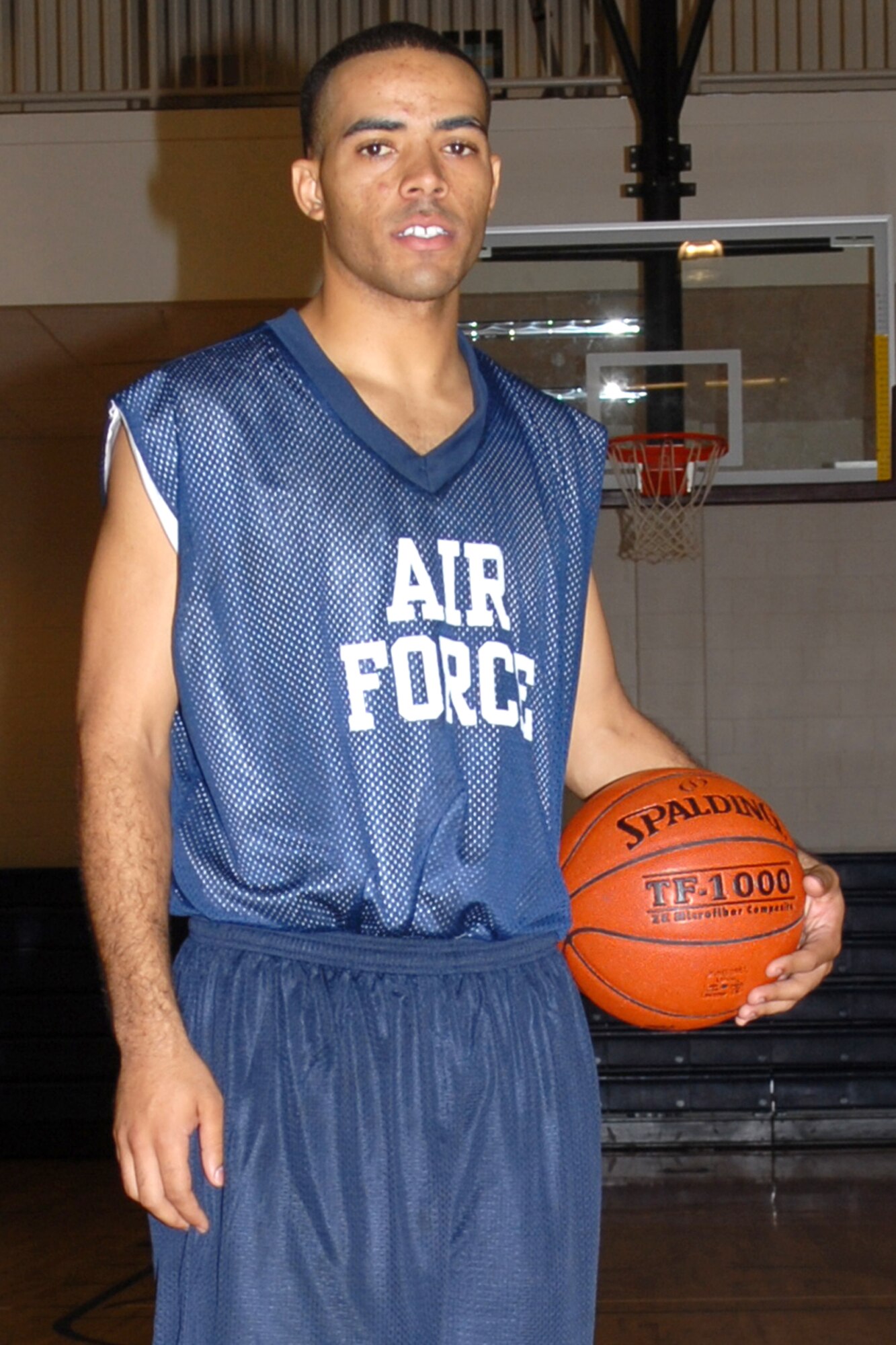 BUCKLEY AIR FORCE BASE, Colo. -- Corneilius Holloway, 96th Medical Group, is trying out for the Air Force basketball team. Holloway, who is trying out for the first time with the team, is striving to make the team and thinks he can contribute solid play from the point guard position. Growing up emulating Michael Jordan and admiring Carmelo Anthony as basketball heroes has sparked a love for the competition of the game. The coach's first assessment of his basketball skills is "He's a natural leader. A good point guard." (U.S. Air Force photo by Airman 1st Class Randi Flaugh) 