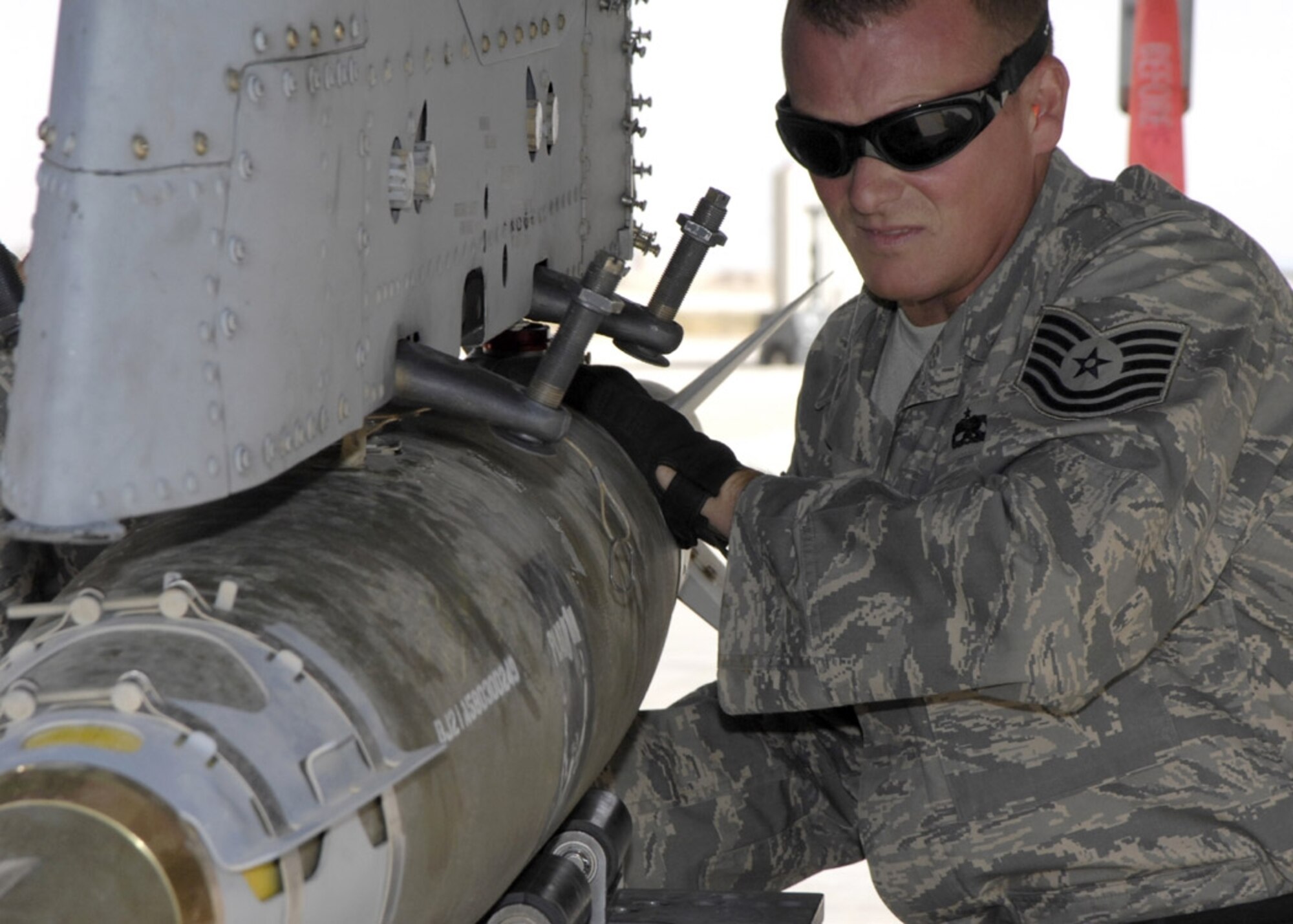 Tech. Sgt. David Rey unloads a Joint Directed Attack Munition to an Air Force A-10 Thunderbolt II.  The A-10s are assigned to the 104th Expeditionary Fighter Squadron, Al Asad Air Base, which is made up primarily of members from the Maryland Air National Guard.  (U.S. Air Force photo by Staff Sgt. Angelique Perez)