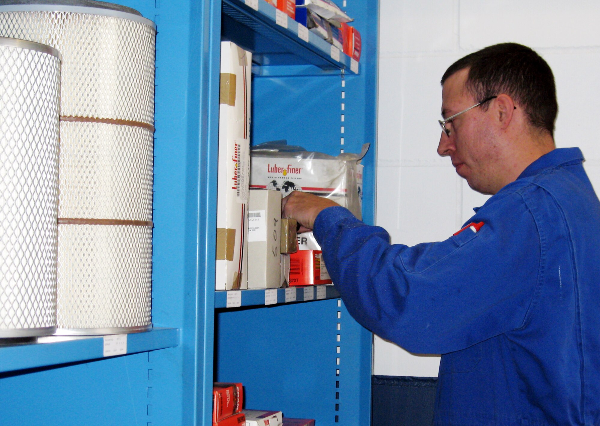Staff Sgt. Ricky Wood, 52nd Logistics Readiness Squadron, reorganizes vehicle repair parts after members of the vehicle maintenance shop relocated their preventive maintenance inspection area. The move was an Air Force Smart Operations for the 21st Century Rapid Improvement Event Oct. 24. (U.S. Air Force photo/Staff Sgt. Tammie Moore) 