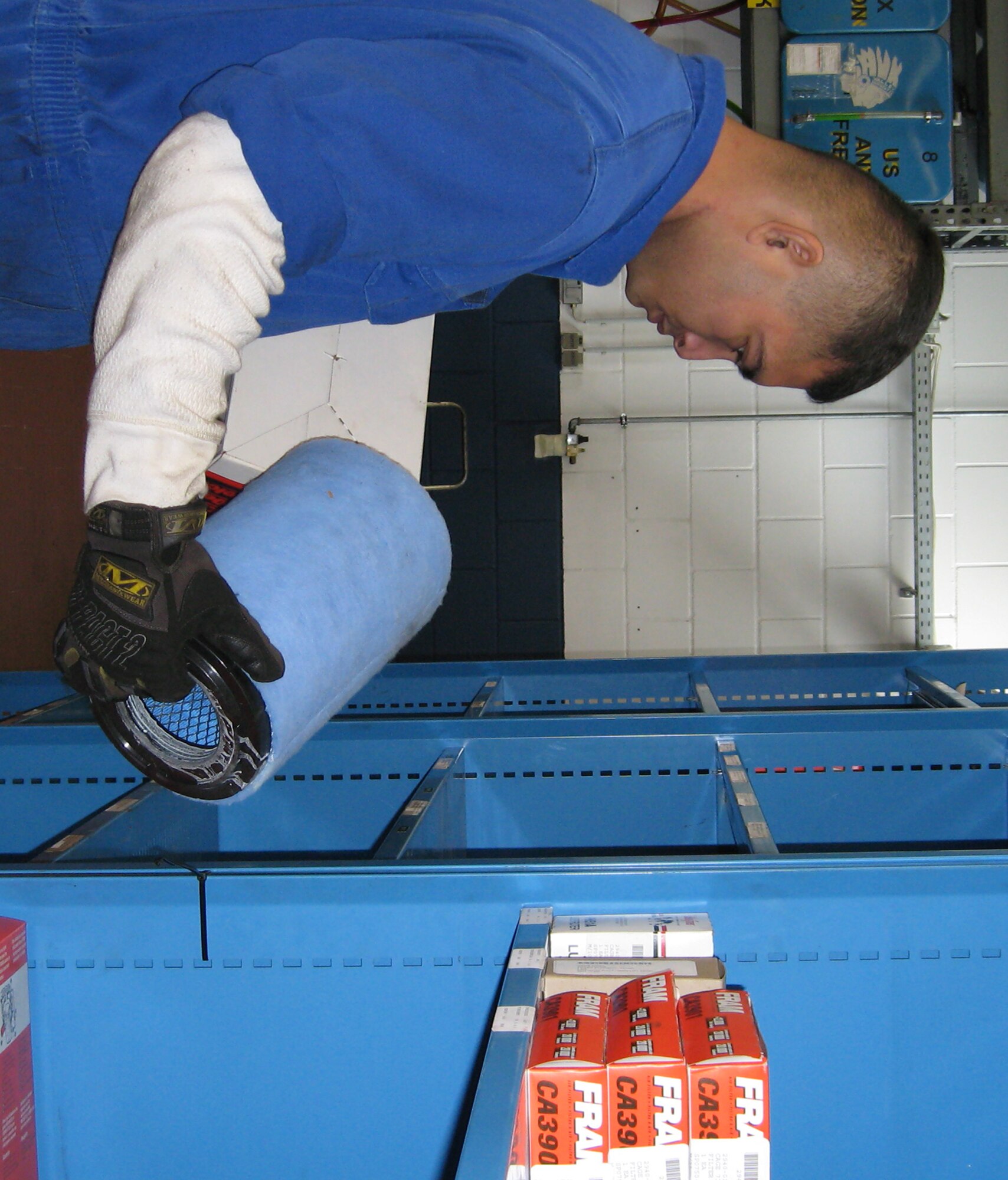 Staff Sgt. Mendiola Fernando, 52nd Logistics Readiness Squadron, stocks air filters after members of the vehicle maintenance shop relocated their preventive maintenance inspection area. The move was an Air Force Smart Operations for the 21st Century Rapid Improvement Event Oct. 24. (U.S. Air Force photo/Staff Sgt. Tammie Moore) 
