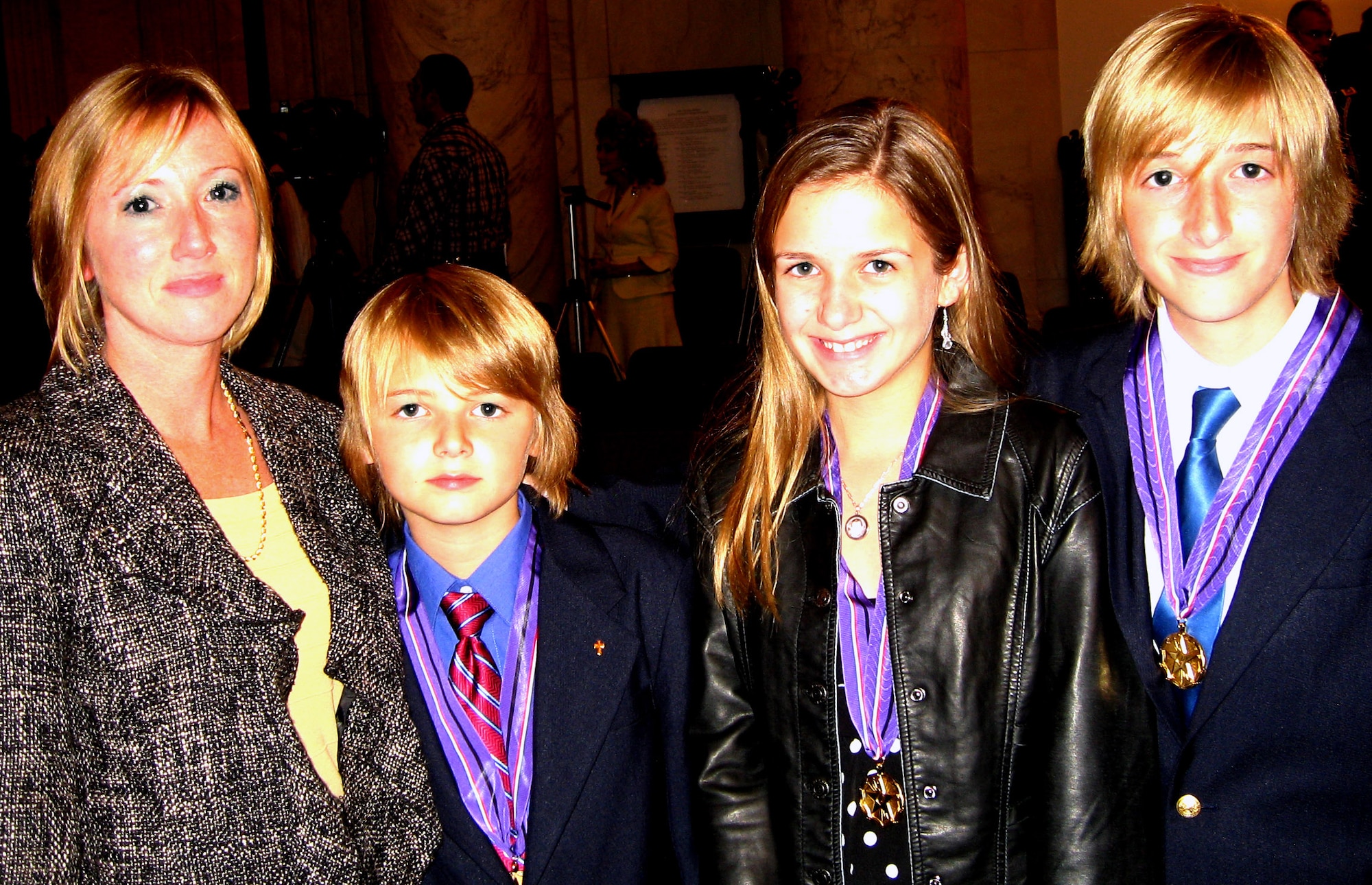 Left to right: Beth Downs and her children Bailey, 10, Elle, 11, and Chandler, 13, attend the White House Commission on Remembrance-sponsored ceremony in the Russell Senate Office Building in Washington, D.C., Oct. 29. Their father, Air Force Maj. William "Brian" Downs, 40, was killed on May 30, 2005, in eastern Diyala province, Iraq, in a crash of an Iraqi air force plane during a training mission. (DoD photo/Gerry J. Gilmore) 
