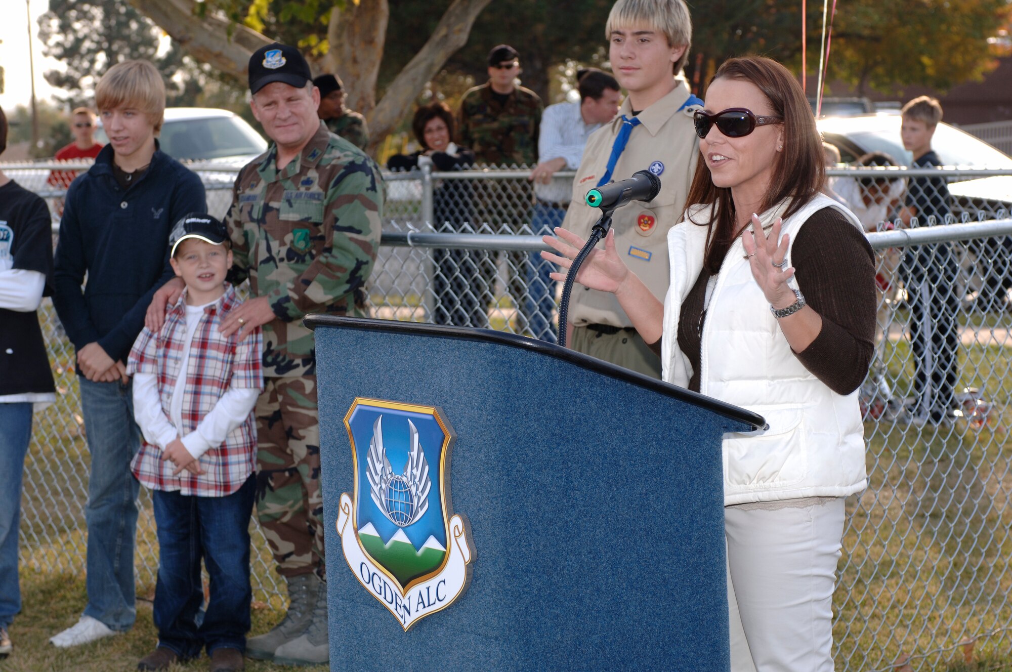 HILL AIR FORCE BASE, Utah-- Suzann Chambers, wife of Col. Scott Chambers, commander for the 75th Air Base Wing, provides comments during the grand opening of the Hill AFB Dog Park. Mrs. Chambers spearheaded the idea for a dog park as a quality of like program.  The dog park, on average, attracts 30 dogs and their owners a day. (U.S. Air Force photo by Todd Cromar)
