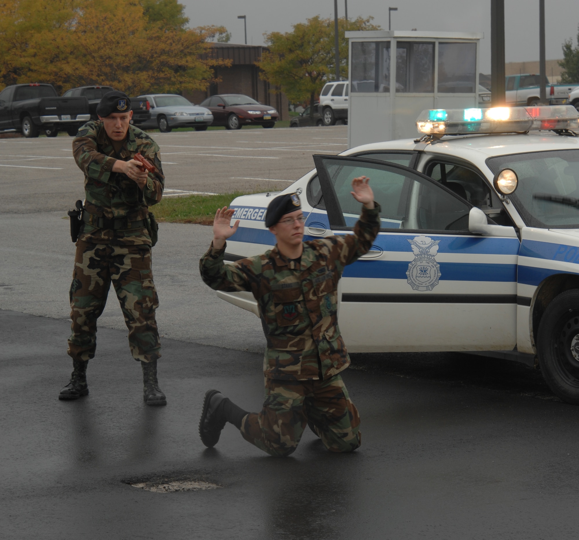 WHITEMAN AIR FORCE BASE, Mo. --  Staff Sgt. Nicholas McCall, 509th Security Forces Squadron, places Airman 1st Class Nathan Staas, 509th SFS, in a position of disadvantage in preparation for searching and handcuffing during the conclusion of a high-risk traffic stop scenario Oct. 26. (U.S. Air Force photo/Tech. Sgt. Samuel A. Park)