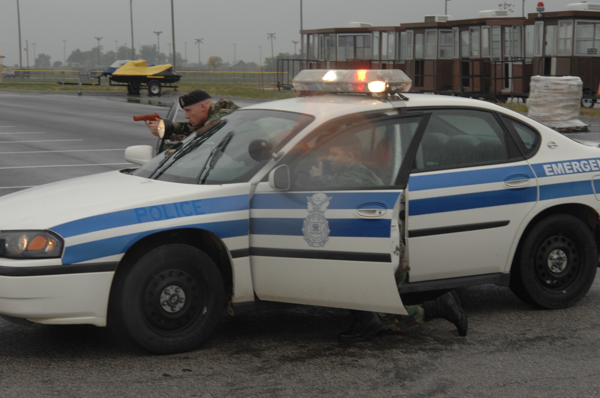 WHITEMAN AIR FORCE BASE, Mo. --  Senior Airman Michael Durso and Staff Sgt. Nicholas McCall, both from the 509th Security Forces Squadron, challenge a vehicle during a high-risk traffic stop scenario during a field training exercise Oct. 26. (U.S. Air Force photo/Tech. Sgt. Samuel A. Park)