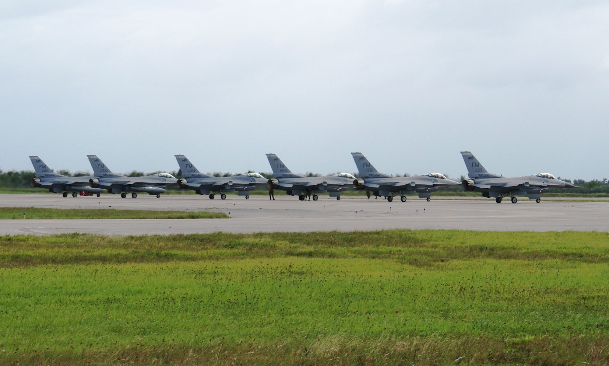 Six F-16 aircraft from the 482nd Fighter Wing, Homestead Air Reserve Base, Fla., await departure Oct. 30, 2007.  A total of 24 F-16 fighter jets left Homestead ARB for Dobbins Air Reserve Base, Ga., as part of preparations for Tropical Storm Noel.  The early evacuation allows pilots and maintenance personnel to return home to south Florida in time to care for their families before a storm. The movement of jets is a precaution to protect this valuable national asset. (U.S. Air Force photo/Tim Norton)
