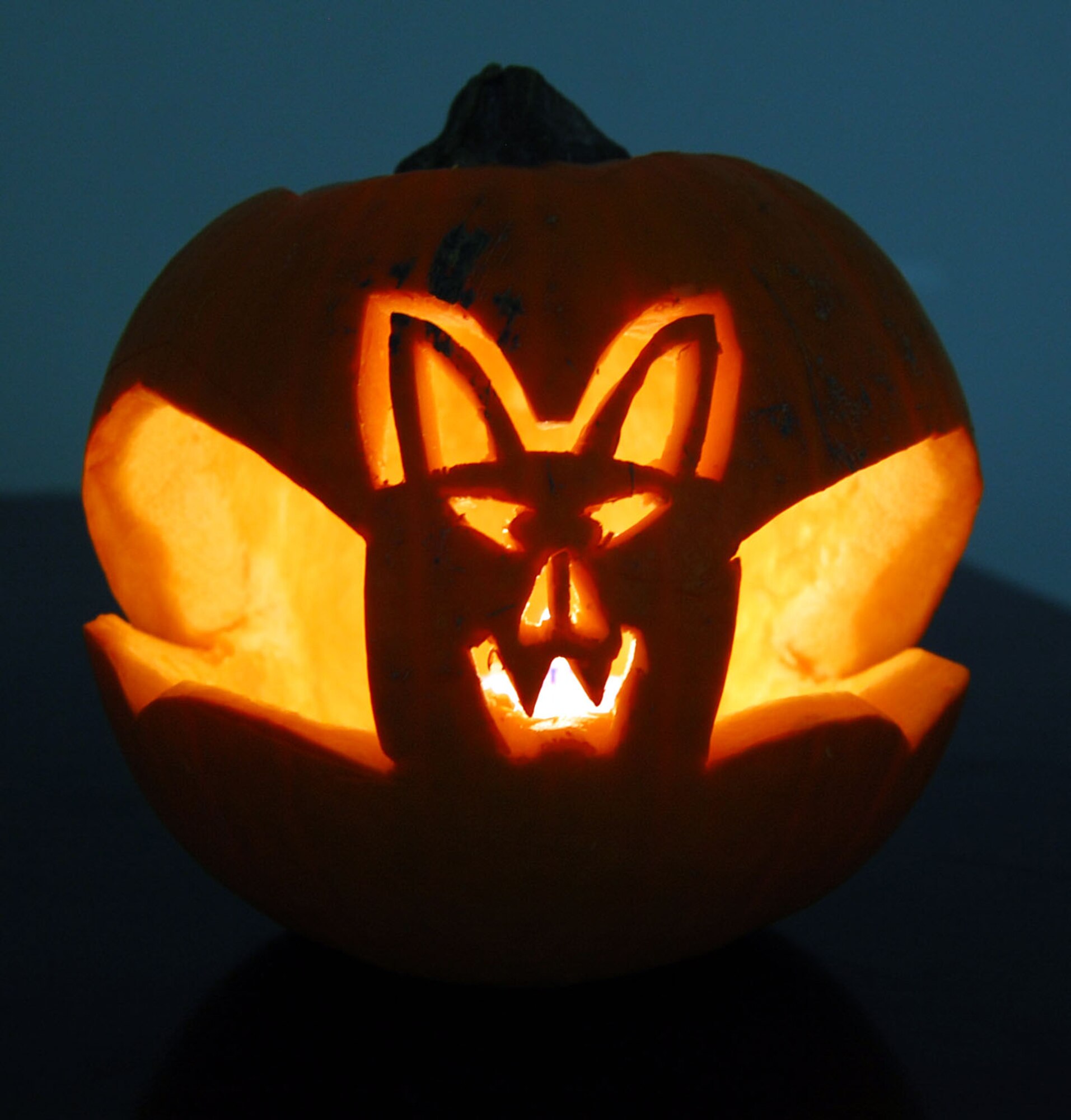 SOUTHWEST ASIA -- Airmen from the 43rd Expeditionary Electronic Combat Squadron decorated a pumpkin with a bat Oct. 30 to help celebrate Halloween at an undisclosed location. 