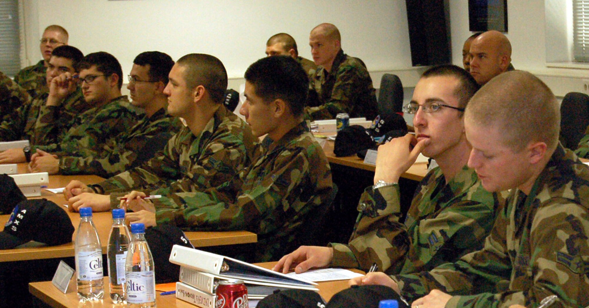 First Term Airman Center Airmen receive a briefing about the deployment process and their responsibilities. The 52nd Fighter Wing will host to the first-ever U.S. Air Forces in Europe Career Assistance Advisor /First Term Airman Center Conference at Spangdahlem Air Base Nov. 16–17. (U.S. Air Force photo/Staff Sgt. Tammie Moore)