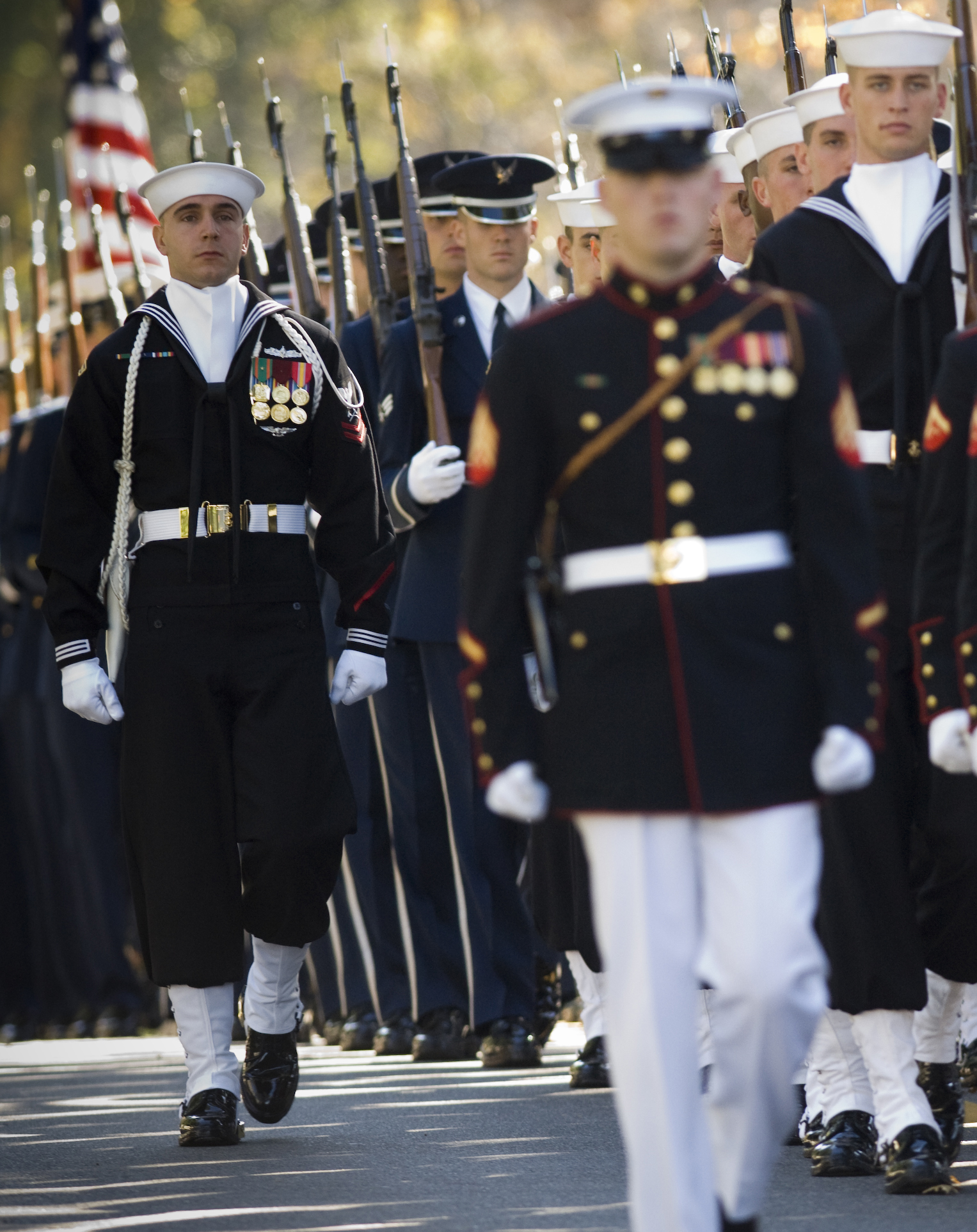 A joint service honor guard escorts the casket of Adm. William J. Crowe ...