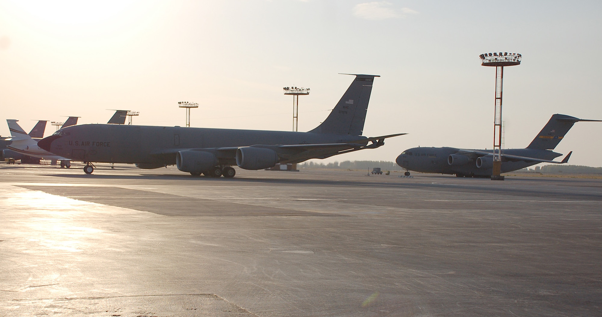 A KC-135 Stratotanker, assigned to Fairchild AFB, Wash., taxis back in from a refueling mission down range Wednesday while an Air Force C-17 Globemaster sits directly behind it.  Fuel capacity for a Stratotanker is 31,275 gallons -- enough for a car to drive 938,250 miles.  (U.S. Air Force photo/Staff Sgt. Les Waters)
