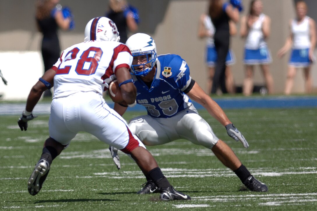 Air Force corner back Garrett Rybak goes one-on-one in the open field with South Carolina State running back Will Ford, during their Sept. 1 game at Falcon Stadium, won by the bluesuiters 34-3. (U.S. Air Force photo/Dave Armer)