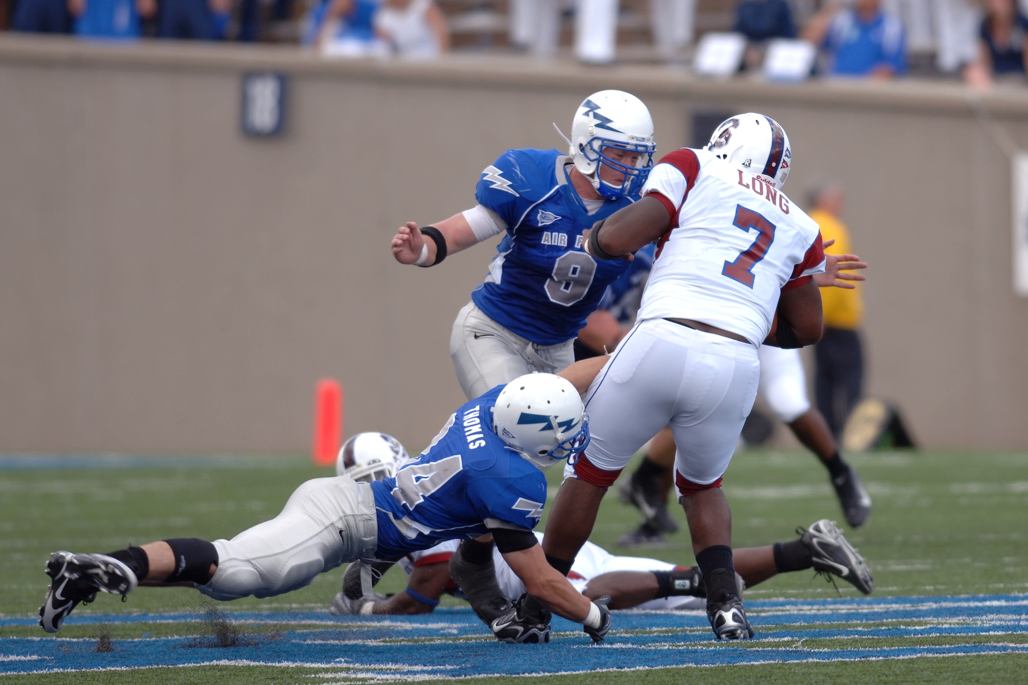 Air Force defenders Chris Thomas and John Rabold get to South Carolina State quarterback Malcomb Long. The Falcons won 34-3 Sept. 1 in their opening game at home. (U.S. Air Force photo/Dave Armer)