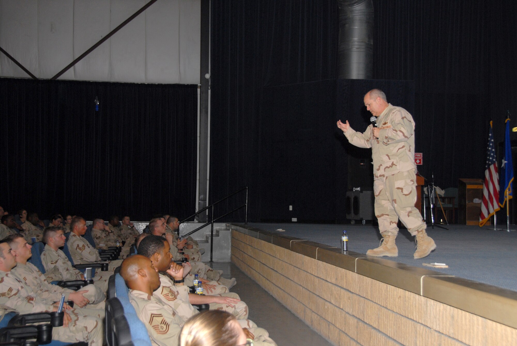 Brig. Gen. Charlie Lyon, 379th Air Expeditionary Wing commander, briefs Airmen at a wing commander’s call. The general spoke about everything the wing has accomplished over the past several months.  (U.S. Air Force photo by Airman 1st Class Ashley Tyler)