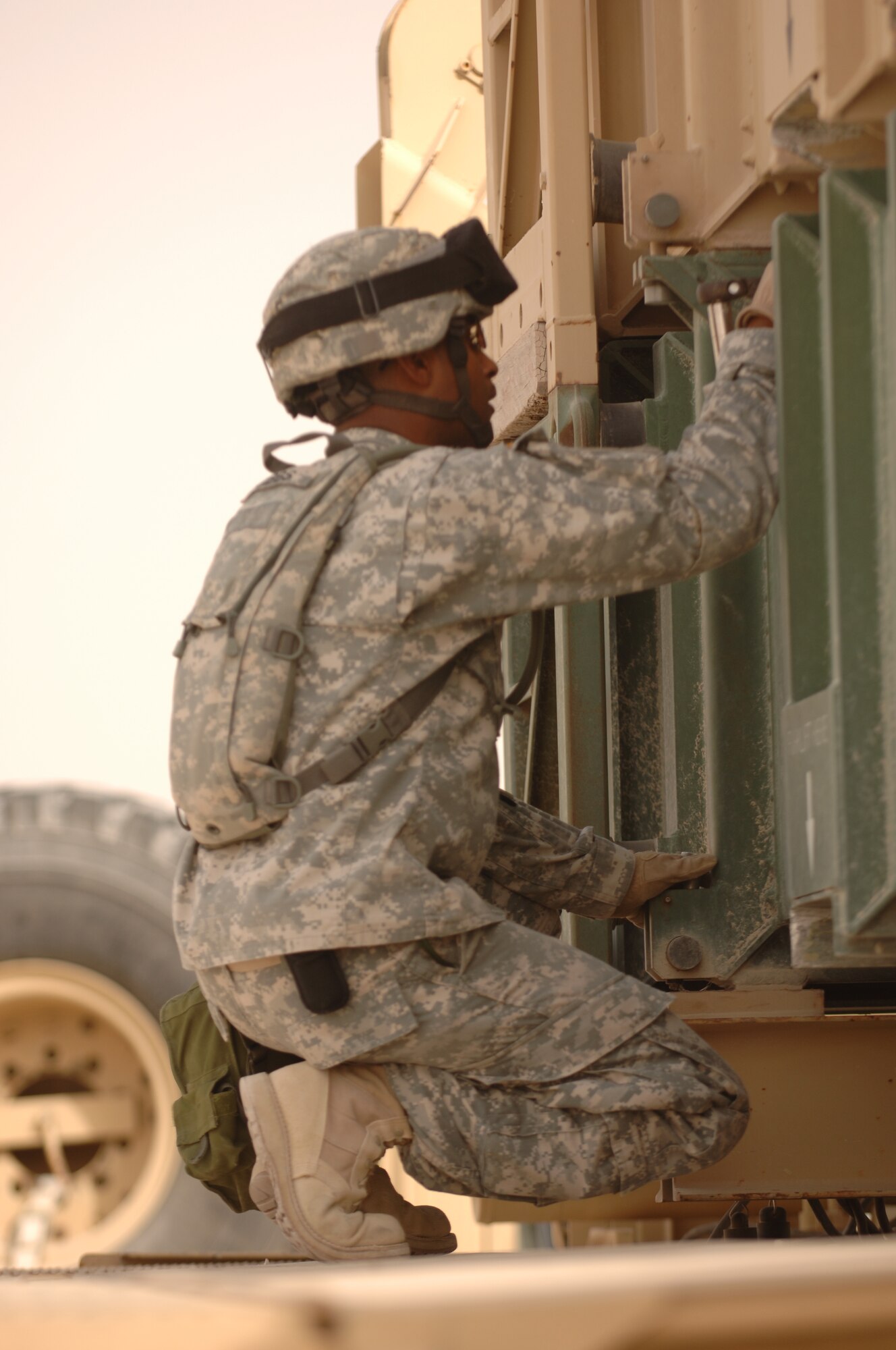 A Soldier with the 3/43 Air Defense Artillery here prepares to disassemble a Patriot missile section for maintenance. The Army unit is deployed here from Fort Bliss, Texas. (U.S. Air Force photo by Master Sgt. Ken Stephens)